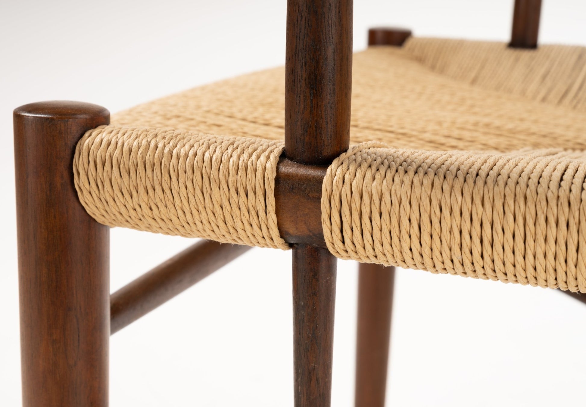 Close-up of tightly woven natural fiber seat on Hvidt & Molgaard Model 317 chair with polished solid wood frame