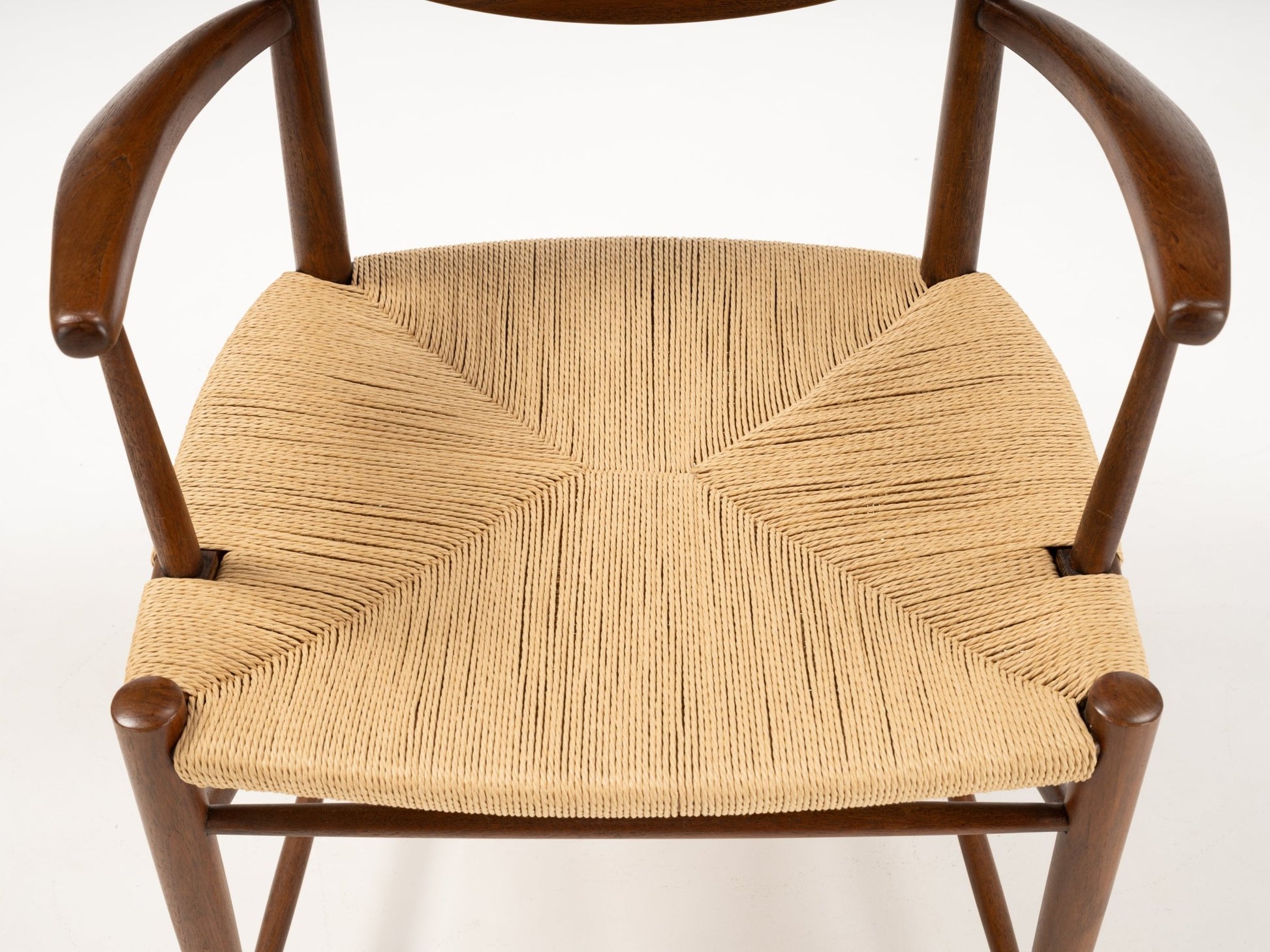 Top view of Hvidt & Molgaard Model 317 chair showing woven cord seat with solid wood frame and curved armrests