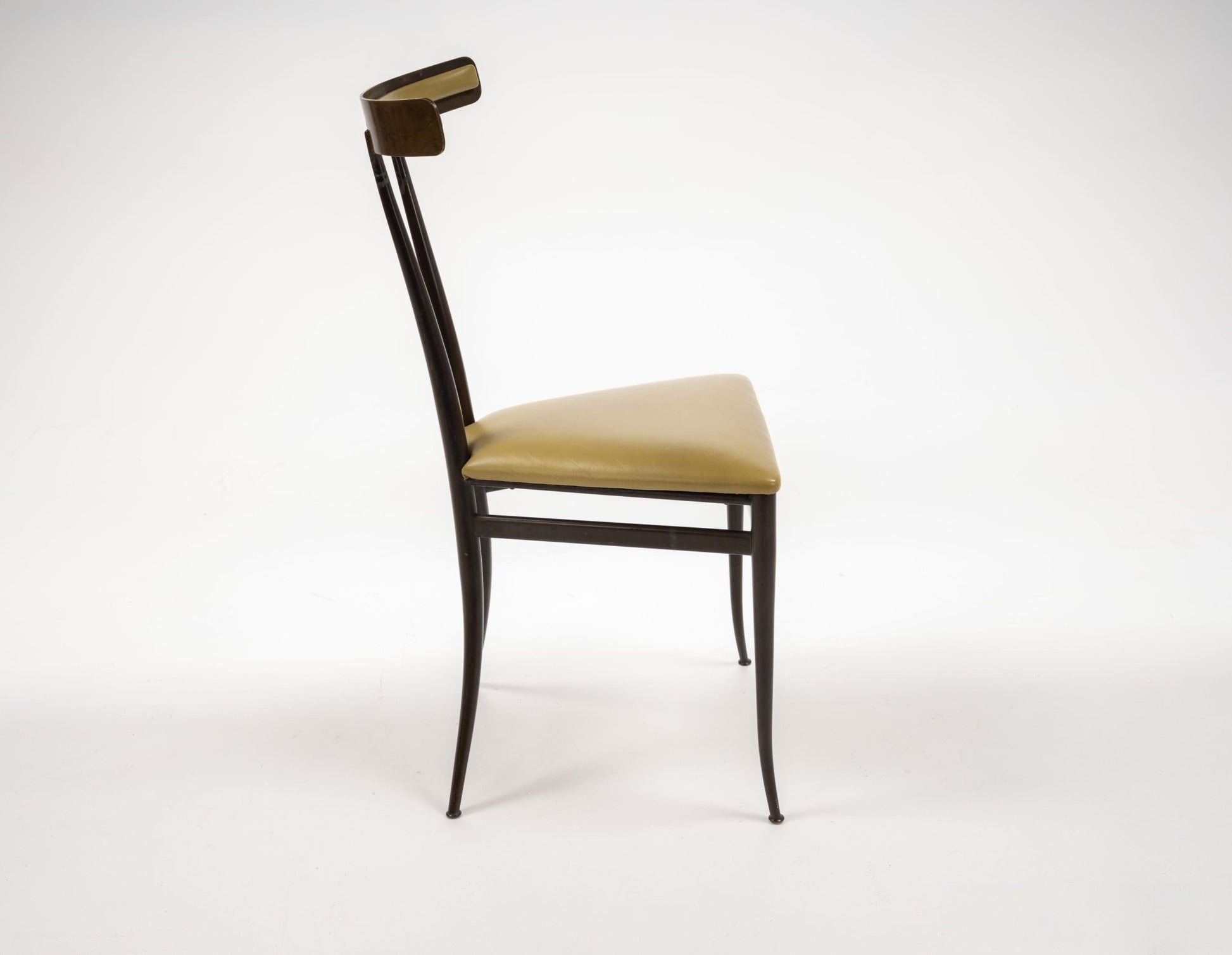 Side view of mid-century Italian brass Klismos chair with sculpted back and chartreuse leather triangular seat