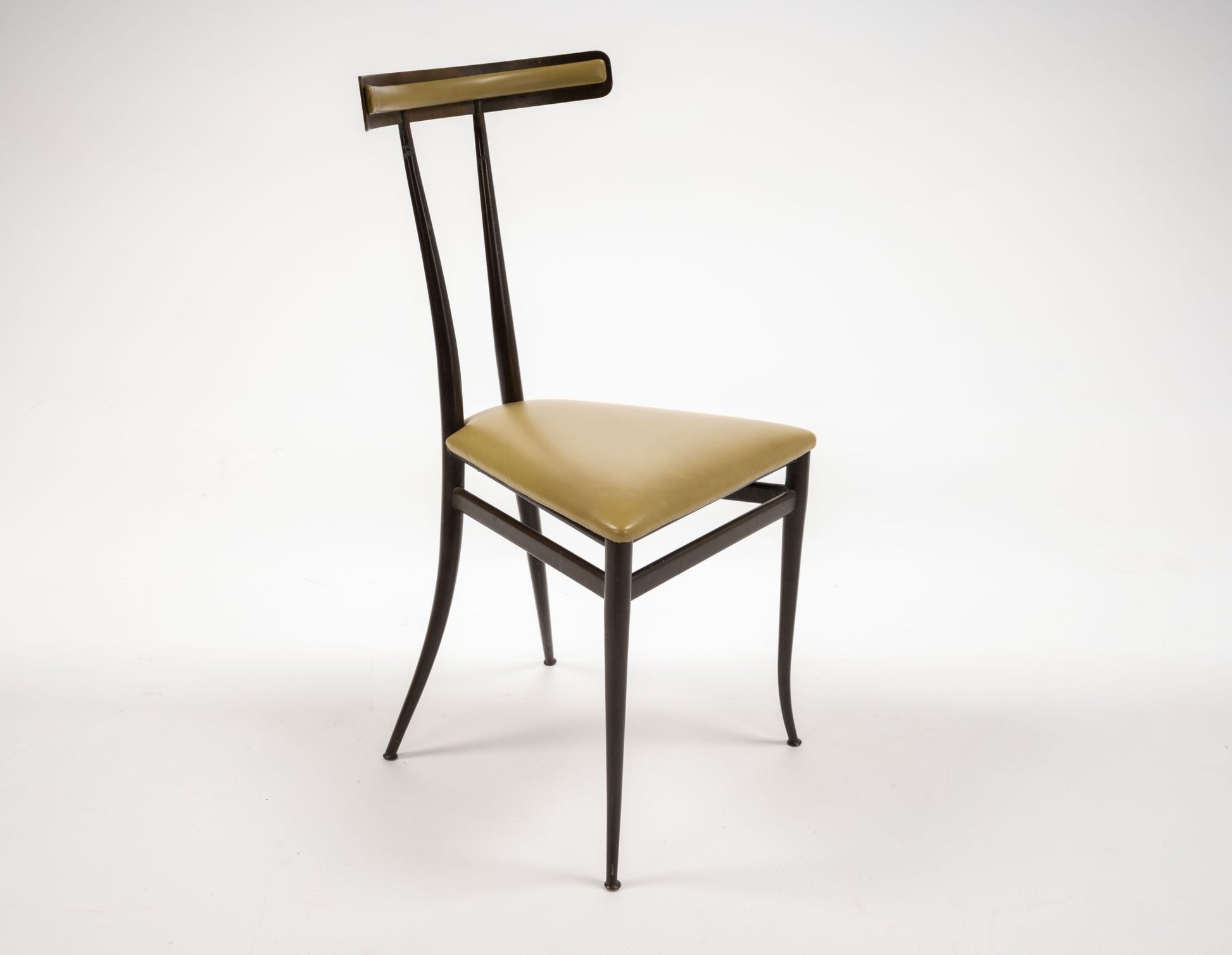 Italian brass Klismos chair with sculpted back and chartreuse leather triangular seat, mid-century Italian design.