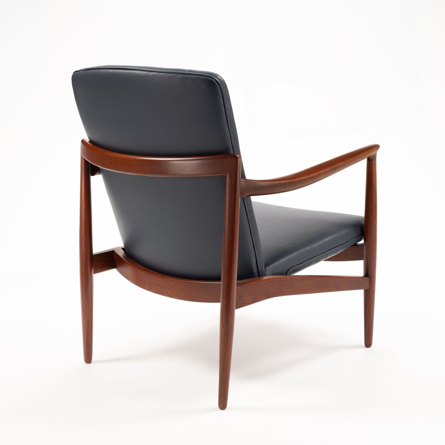 Jacob Kjaer Adjustable Lounge Chair rear view with black leather upholstery sculpted rosewood frame curved arms and tapered legs in mid century modern furniture style
