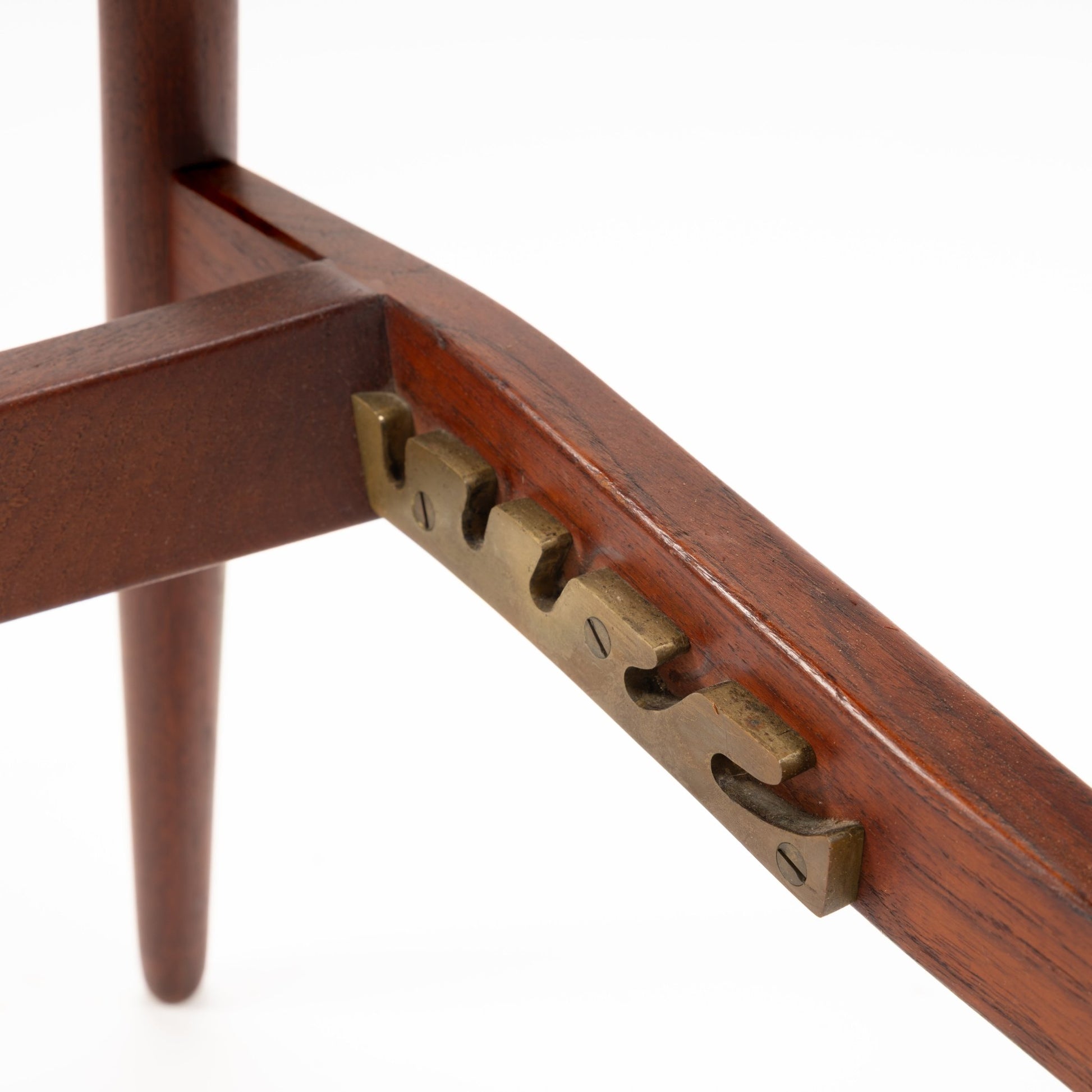Jacob Kjaer Adjustable Lounge Chair close detail showing polished rosewood frame brass adjustment mechanism and tapered leg in mid century modern furniture style