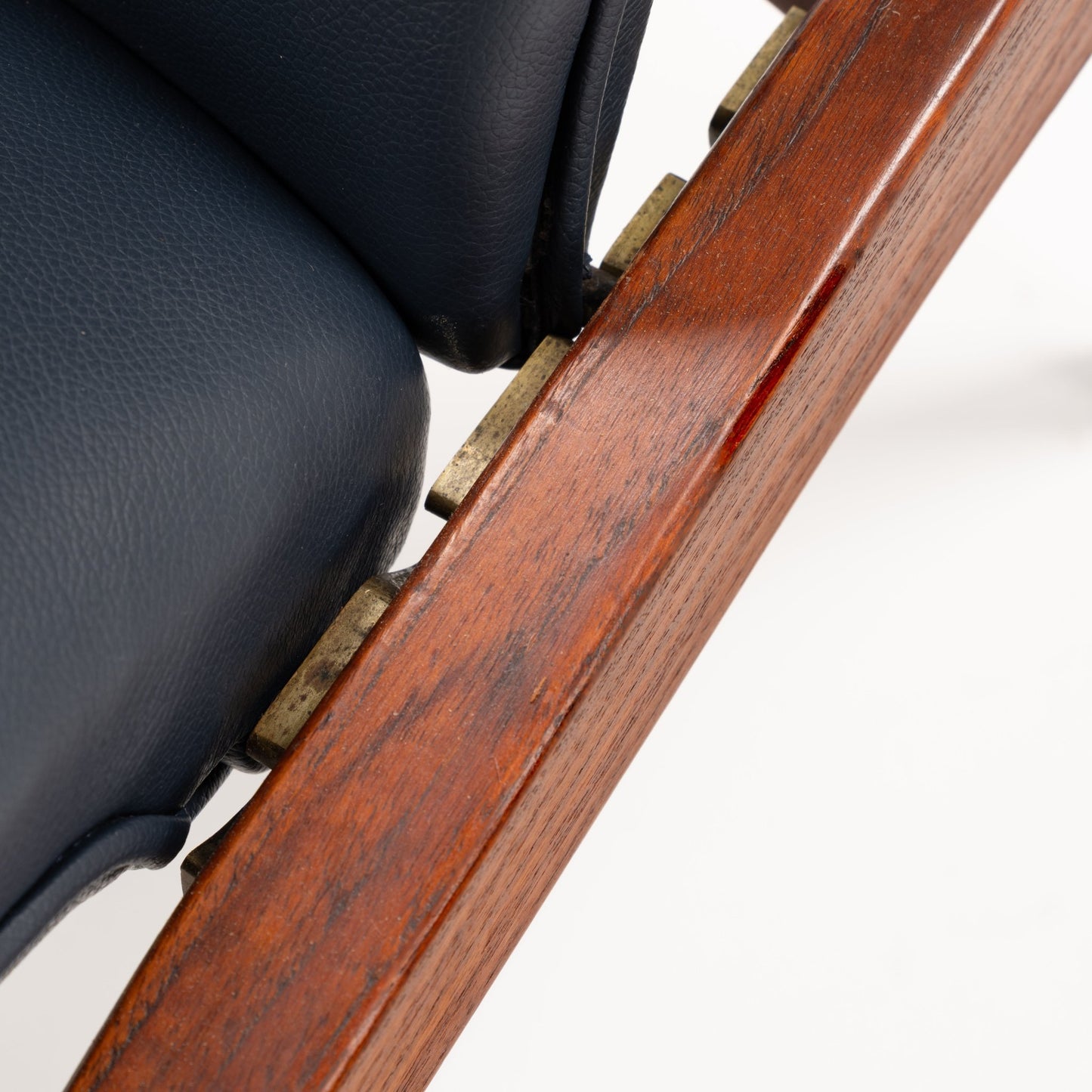 Jacob Kjaer Adjustable Lounge Chair close detail of black leather upholstery and polished rosewood frame with brass adjustment hardware in vintage Danish furniture style