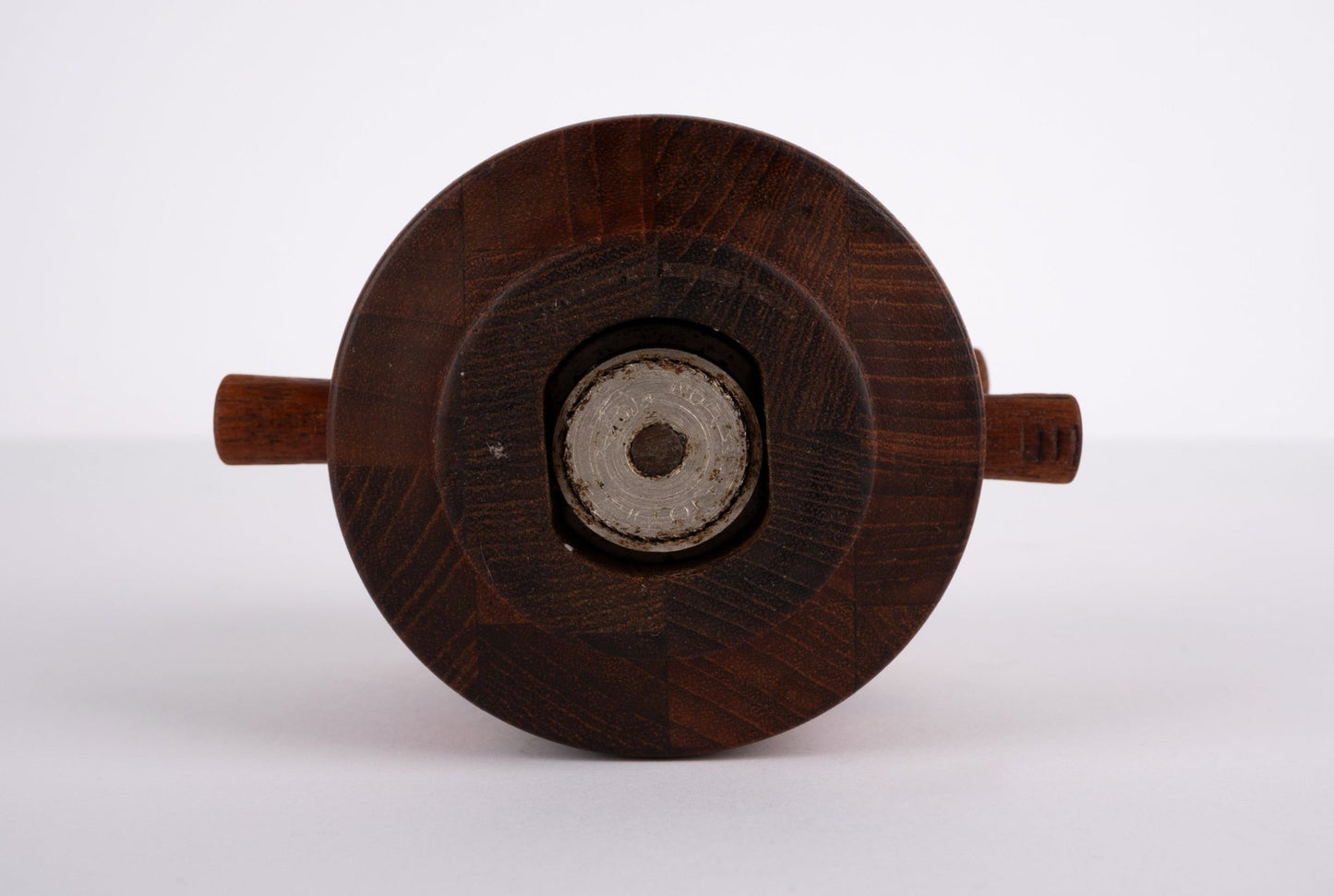 Bottom view of 1964 Jens Quistgaard Danish salt shaker and pepper grinder with end grain teak and metal Peugeot mechanism