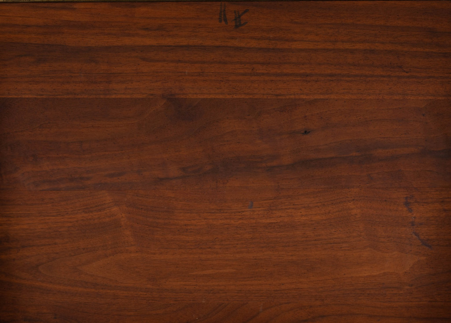 Close-up of rich walnut wood grain surface from vintage Jens Risom 1960s bedside table pair