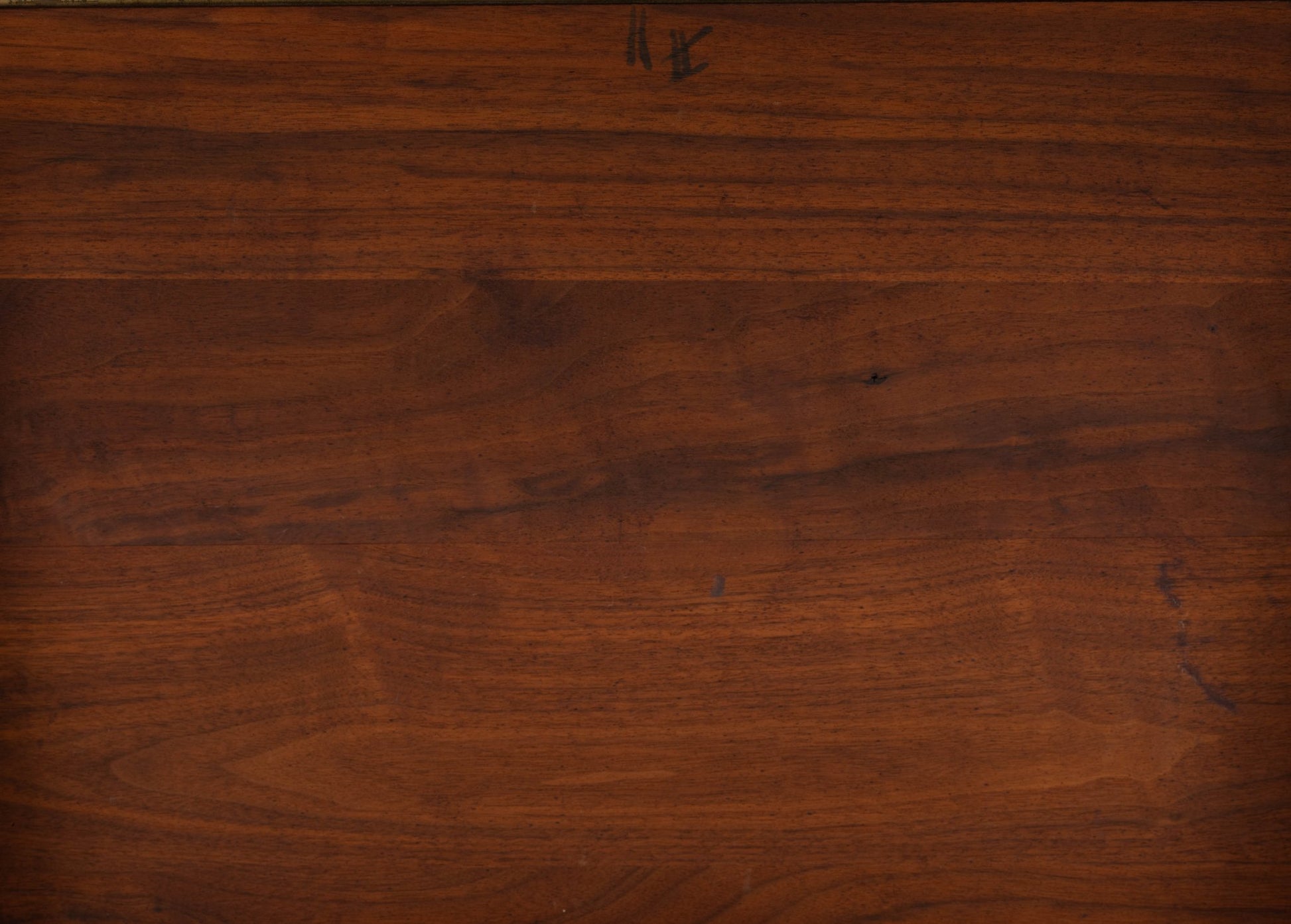 Close-up of rich walnut wood grain surface from vintage Jens Risom 1960s bedside table pair