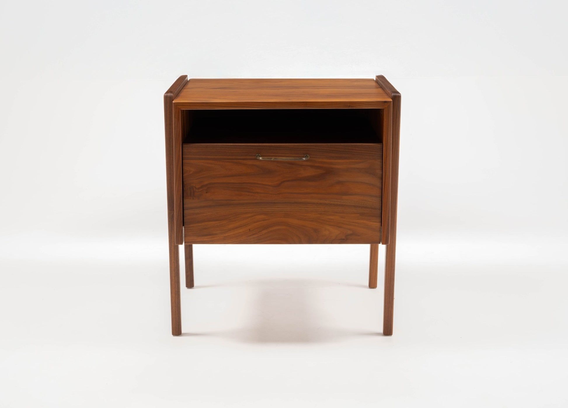 Pair of Jens Risom walnut bedside tables with open top compartment and fall-front lower drawer, 1960s design