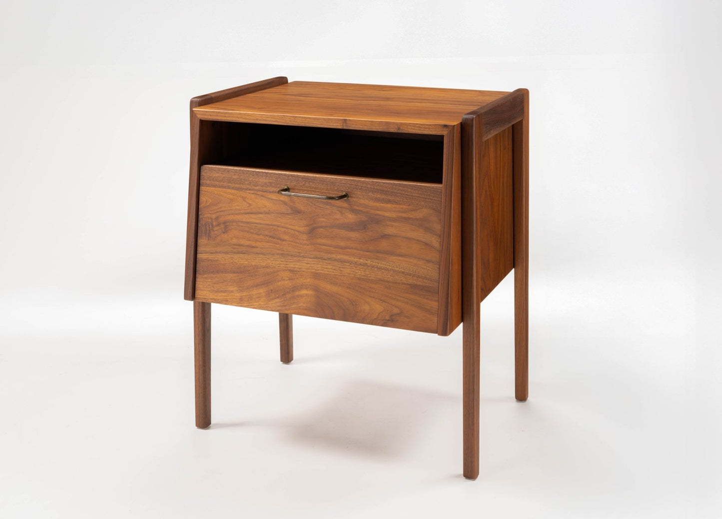 Mid-century modern walnut bedside table by Jens Risom with open shelf and fall-front drawer on tapered legs