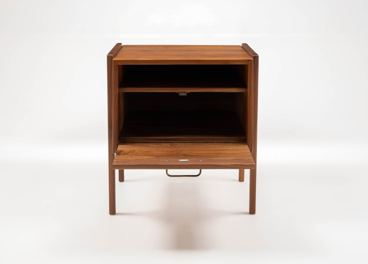 Pair of mid-century modern walnut Jens Risom bedside tables with open shelf and fall-front drawer, circa 1960s.