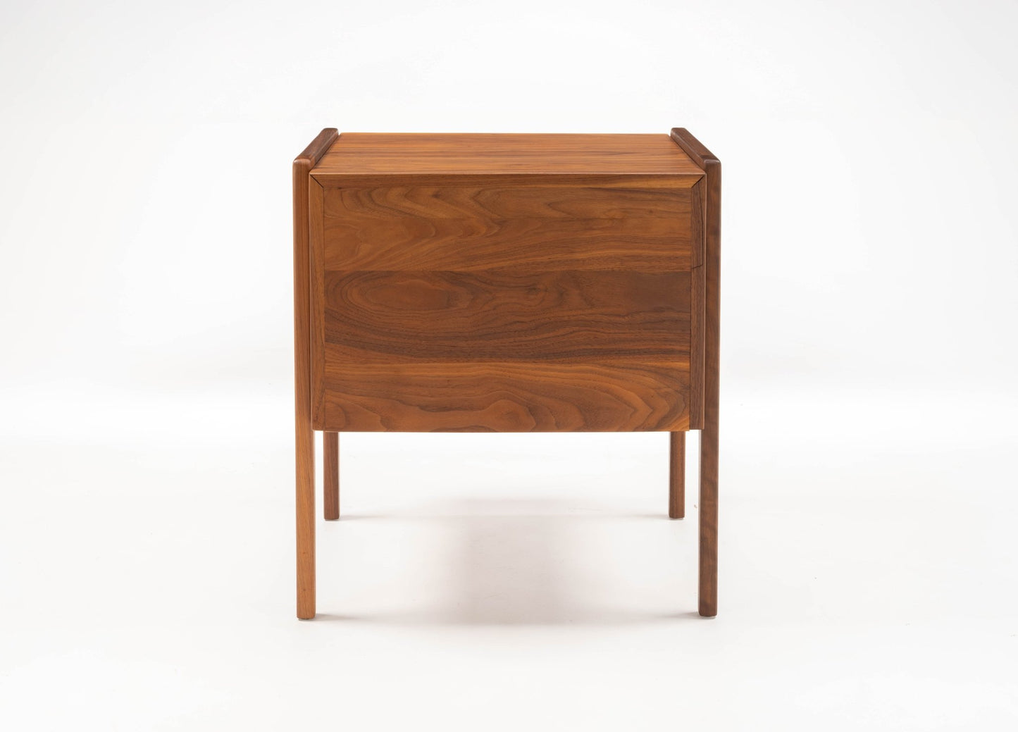 Pair of mid-century modern walnut bedside tables with fall-front drawers and open compartments on tapered legs.