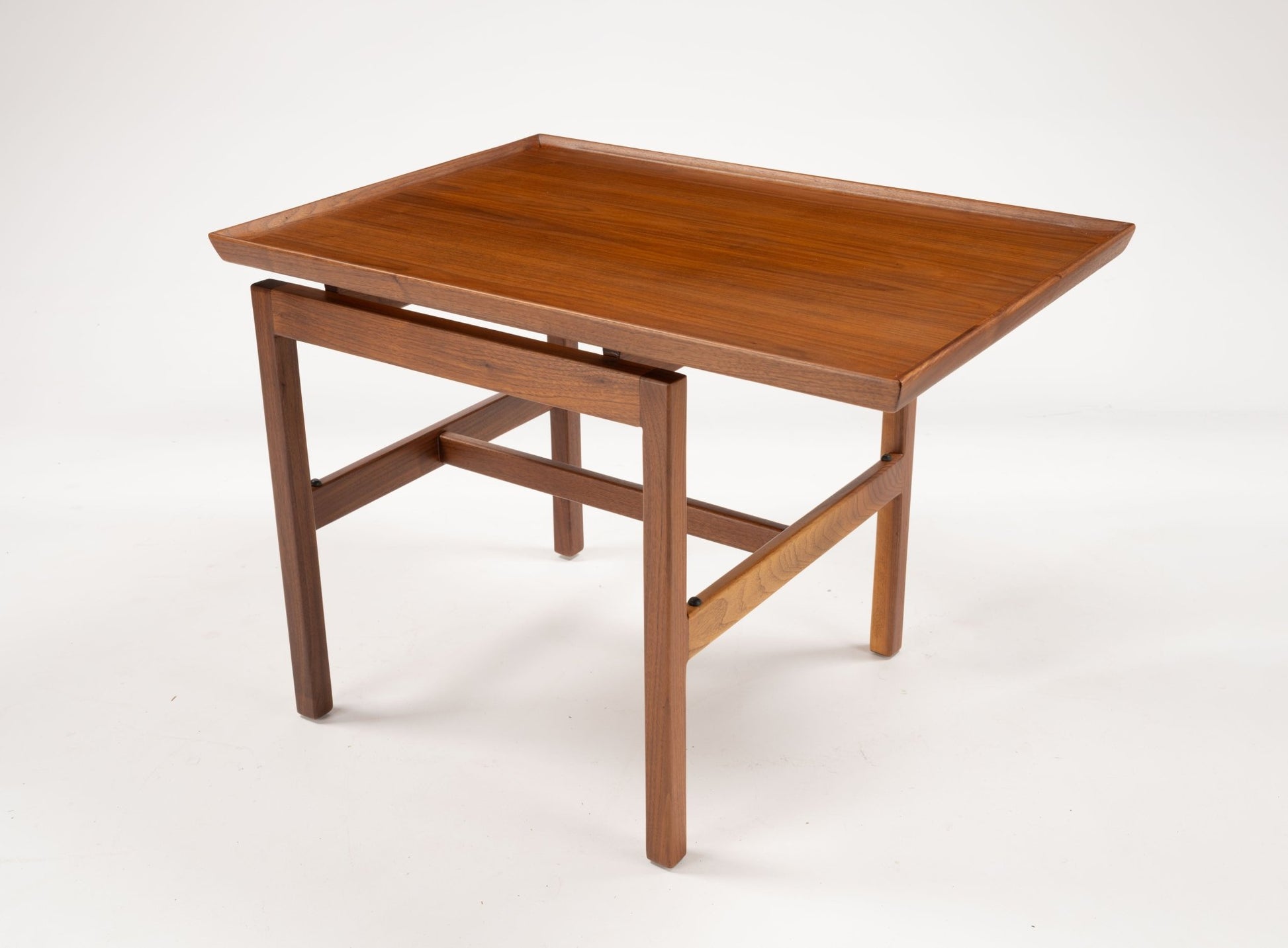 Mid-century modern Jens Risom cantilever side table in walnut with off-center rectangular top and gallery edge