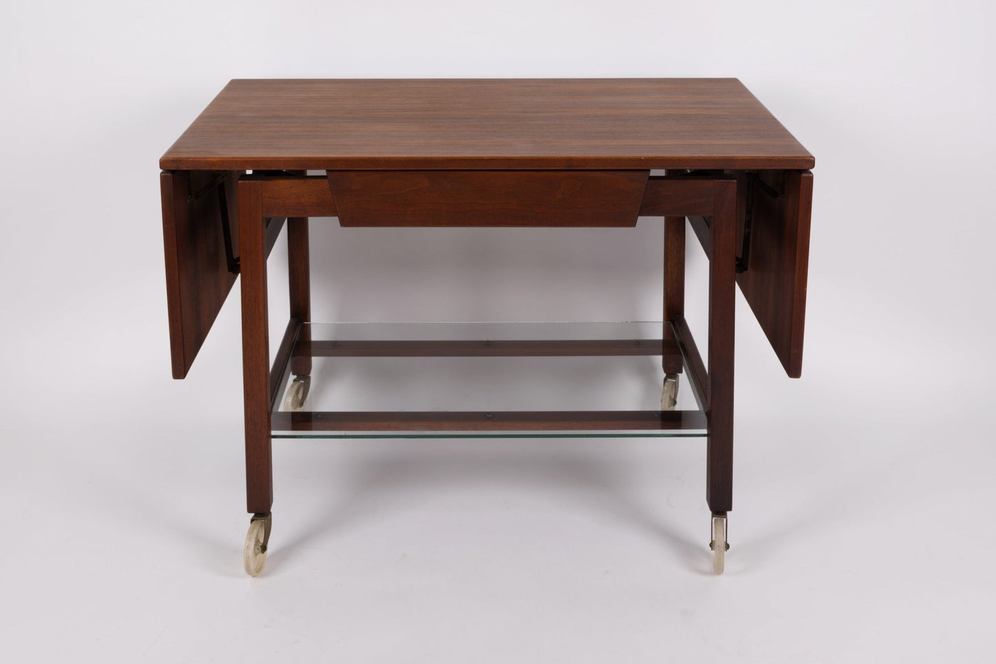 Rare 1960s Jens Risom expandable serving cart with wooden leaves and glass bottom shelf on casters