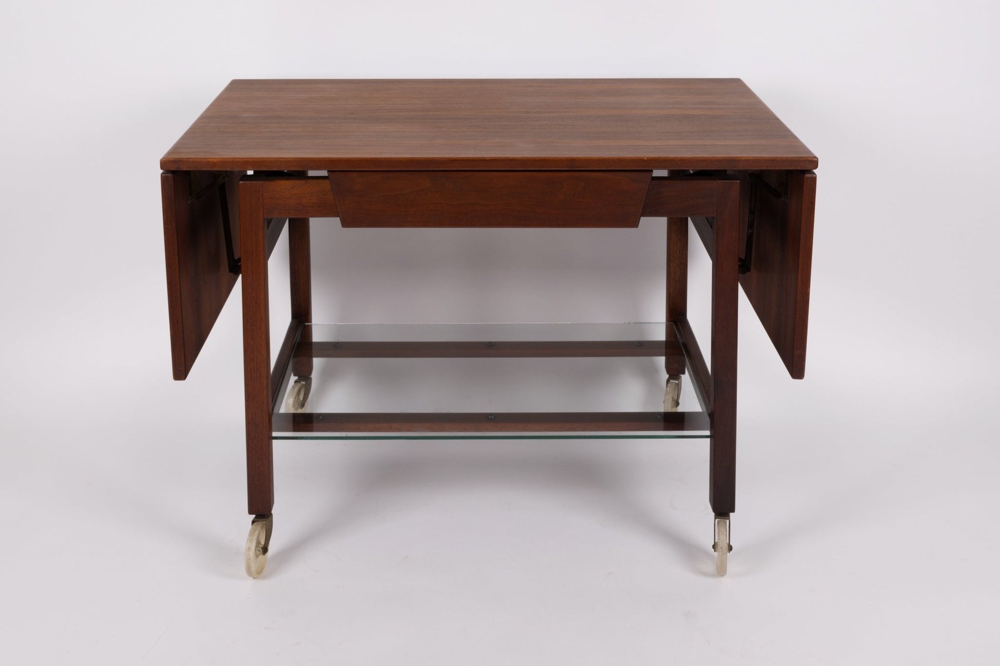 Rare 1960s Jens Risom expandable serving cart with wooden leaves and glass bottom shelf on casters