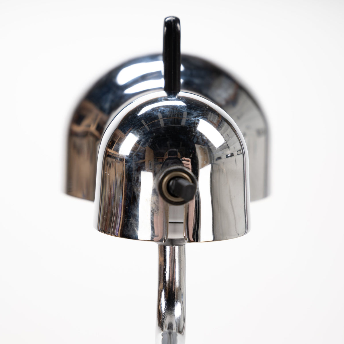 Joe Colombo Chrome Topo Floor Lamp closeup with polished chrome dome shade black adjustment knob and vertical stem in mid century modern lighting design
