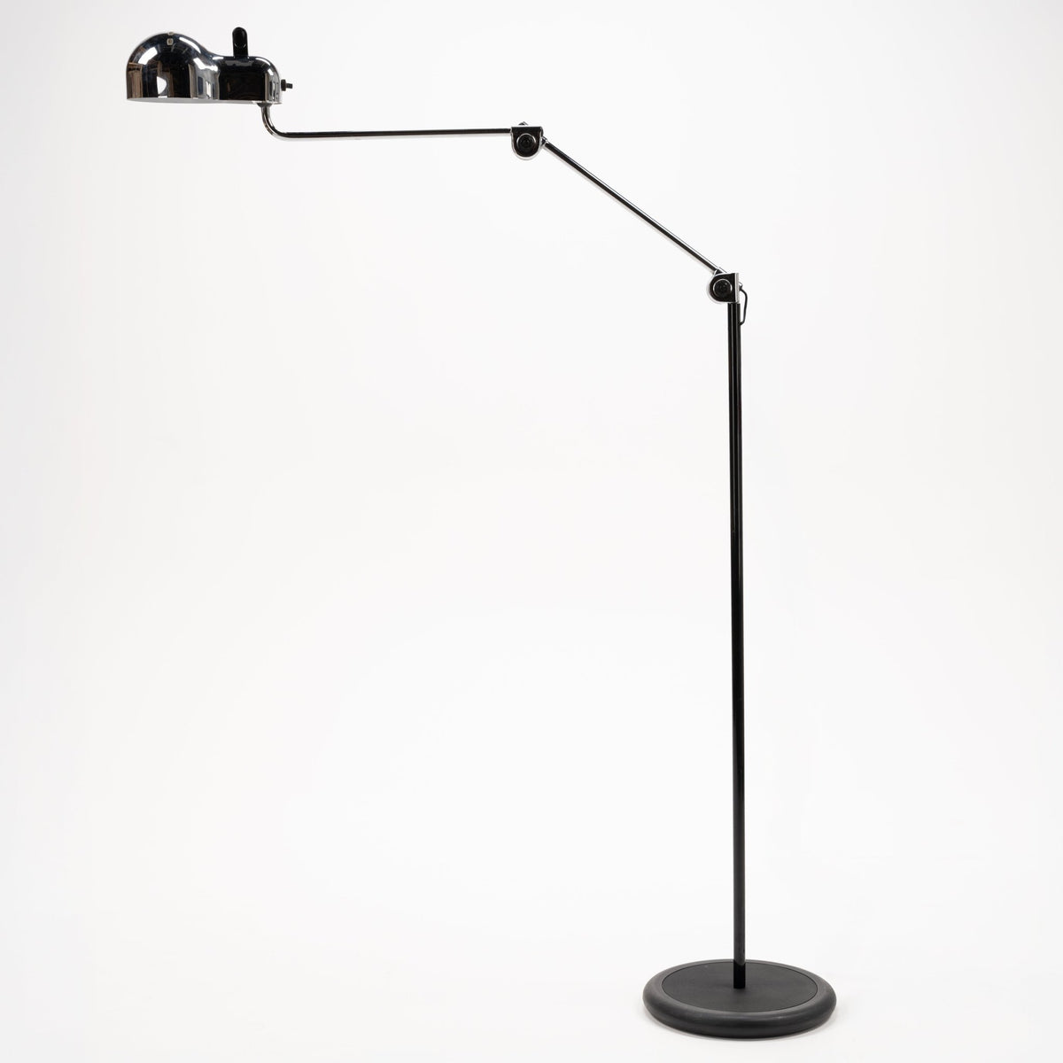 Joe Colombo Chrome Topo Floor Lamp with articulated black arm polished chrome dome shade and weighted round base in mid century modern lighting