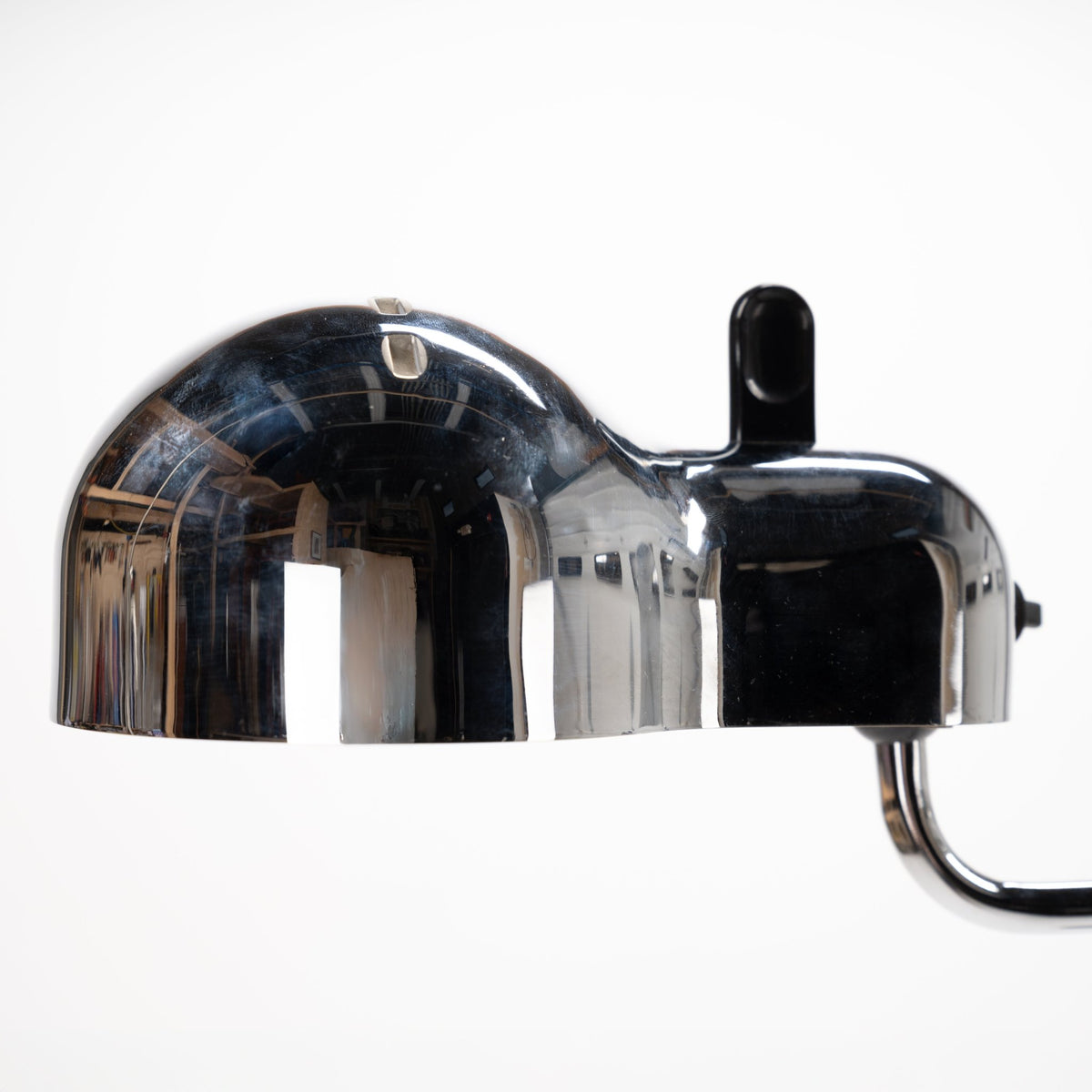 Joe Colombo Chrome Topo Floor Lamp closeup showing reflective chrome dome shade black adjustment lever and curved electrical cord in mid century modern lighting