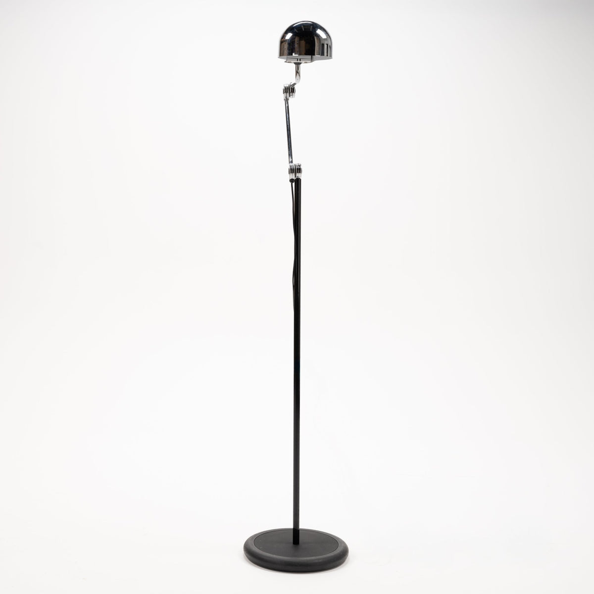 Joe Colombo Chrome Topo Floor Lamp with polished chrome dome shade slim black stem and round weighted base in modern lighting design