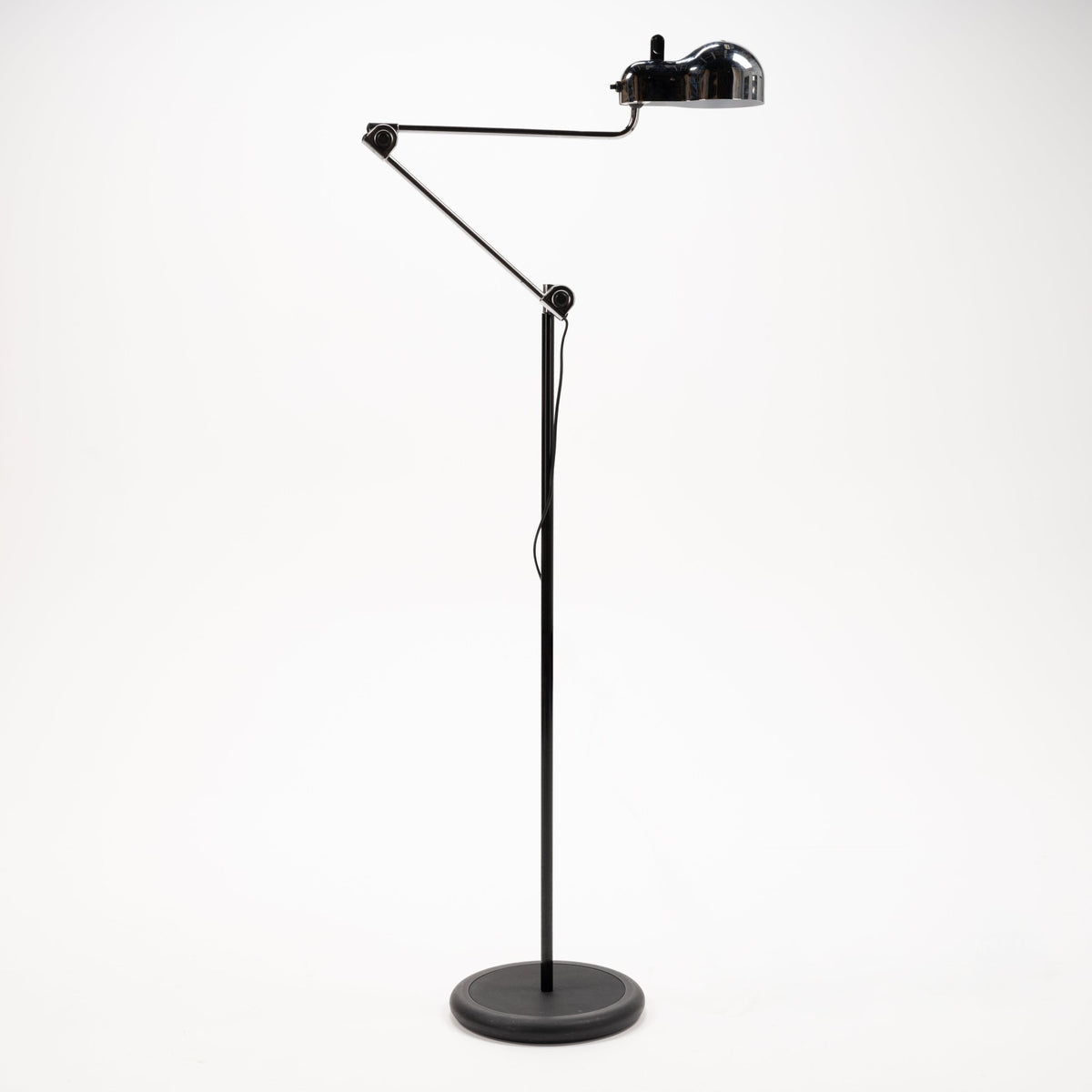 Joe Colombo Chrome Topo Floor Lamp with polished chrome dome shade articulated arm slender black stem and round weighted base in mid century modern lighting