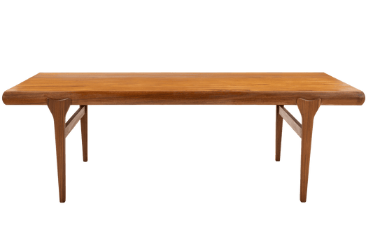 Rectangular teak coffee table with rounded edges and tapered legs showcasing Danish mid-century design craftsmanship