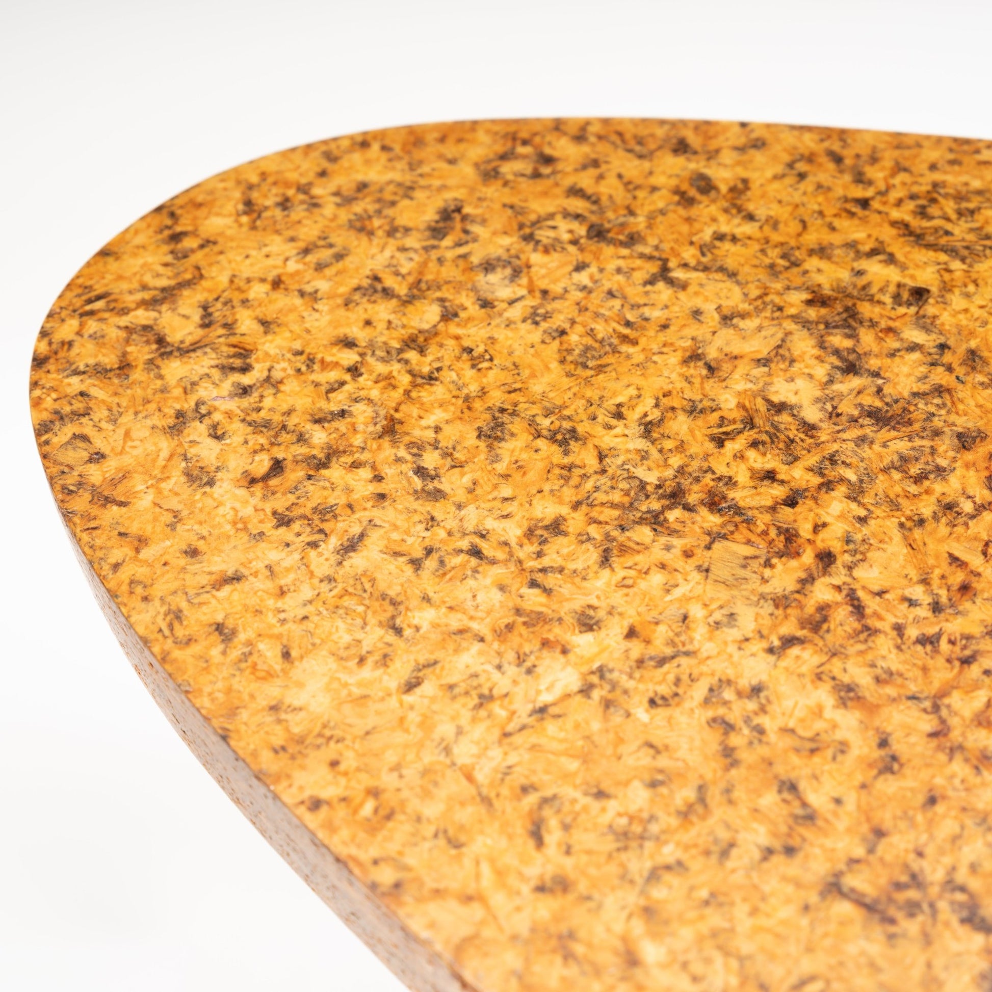 John Keal 'Outrigger' Coffee Table close-up showing the textured organic-shaped cork tabletop with rich natural patterns, highlighting mid century modern furniture design.
