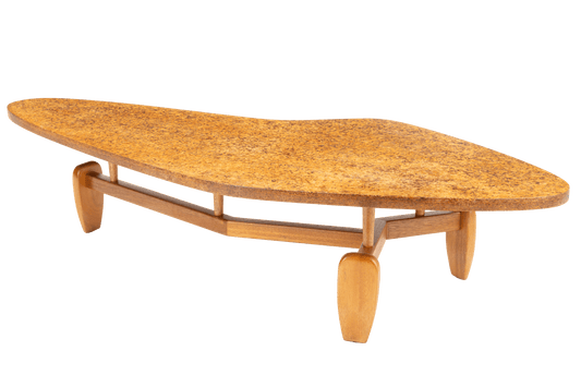 John Keal 'Outrigger' Coffee Table featuring an organic-shaped cork top supported by sculptural wooden legs with a curved stretcher, exemplifying mid century modern furniture design.