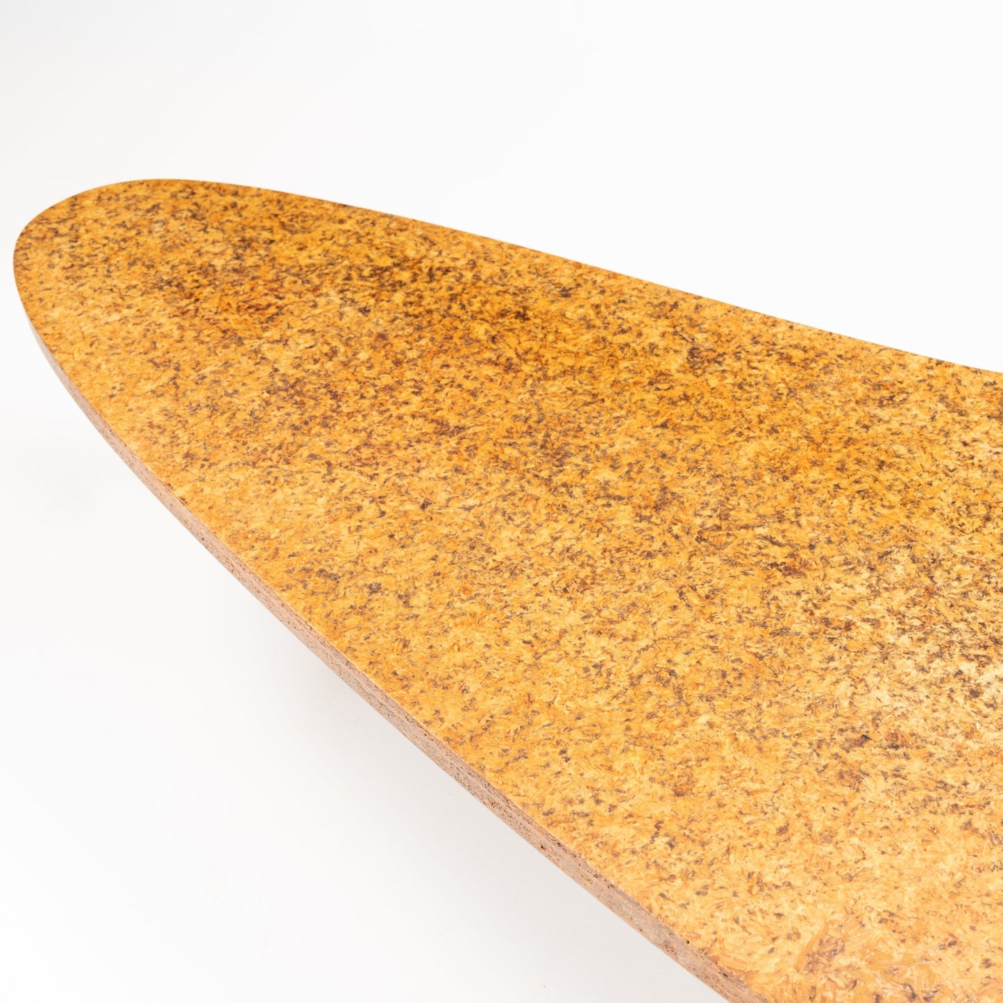 John Keal 'Outrigger' Coffee Table close-up highlighting the warm, textured cork surface with its organic shape, reflecting mid century modern furniture style.
