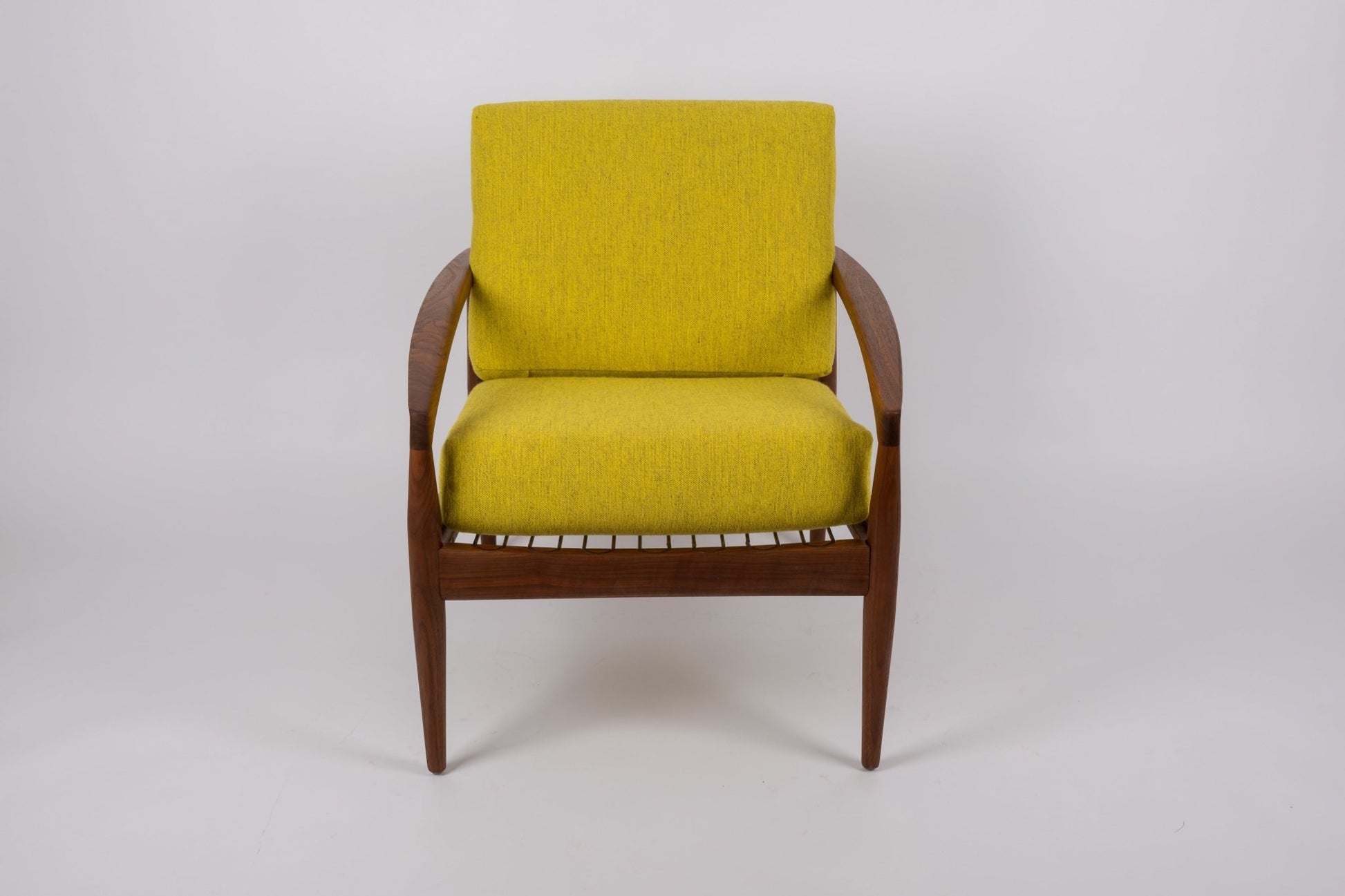 Kai Kristiansen 'Paper Knife' armchair with solid teak frame and mustard yellow cushions from 1950s Denmark.
