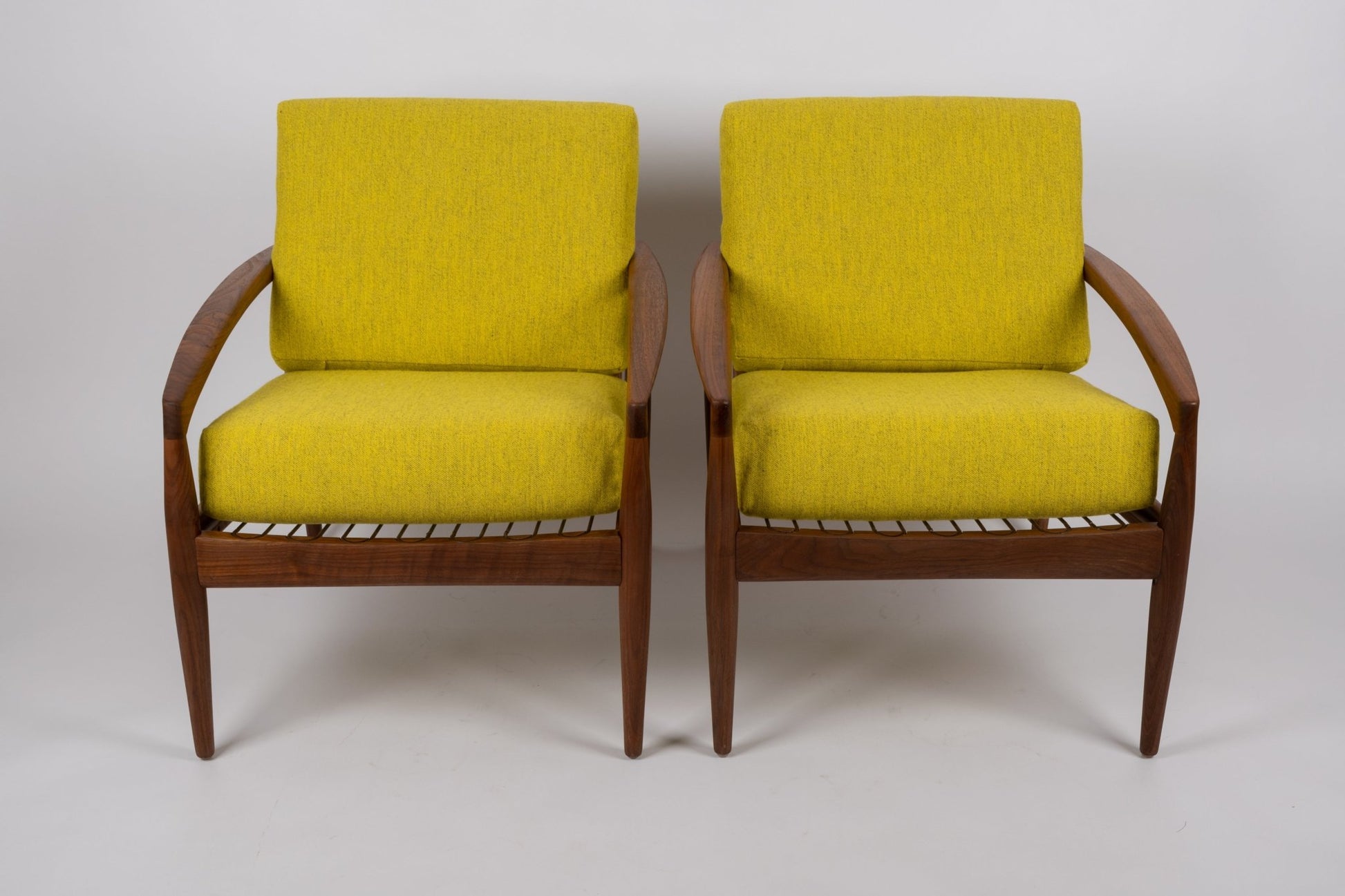 Pair of 1960s Kai Kristiansen 'Paper Knife' chairs in solid teak with slatted seats and yellow cushions from Denmark