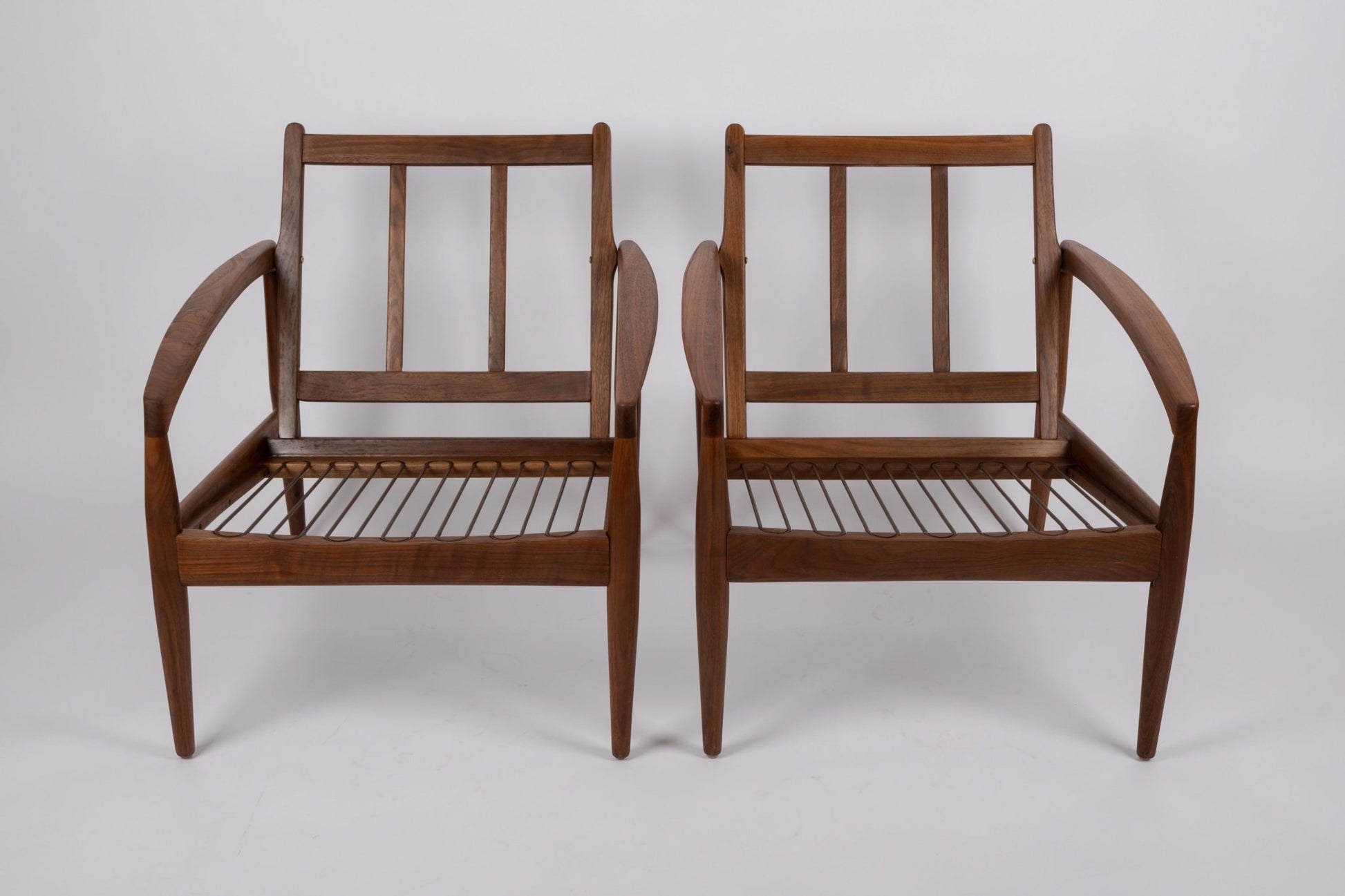 Pair of 1950s Kai Kristiansen 'Paper Knife' chairs with solid teak frames and slatted seats from Denmark.