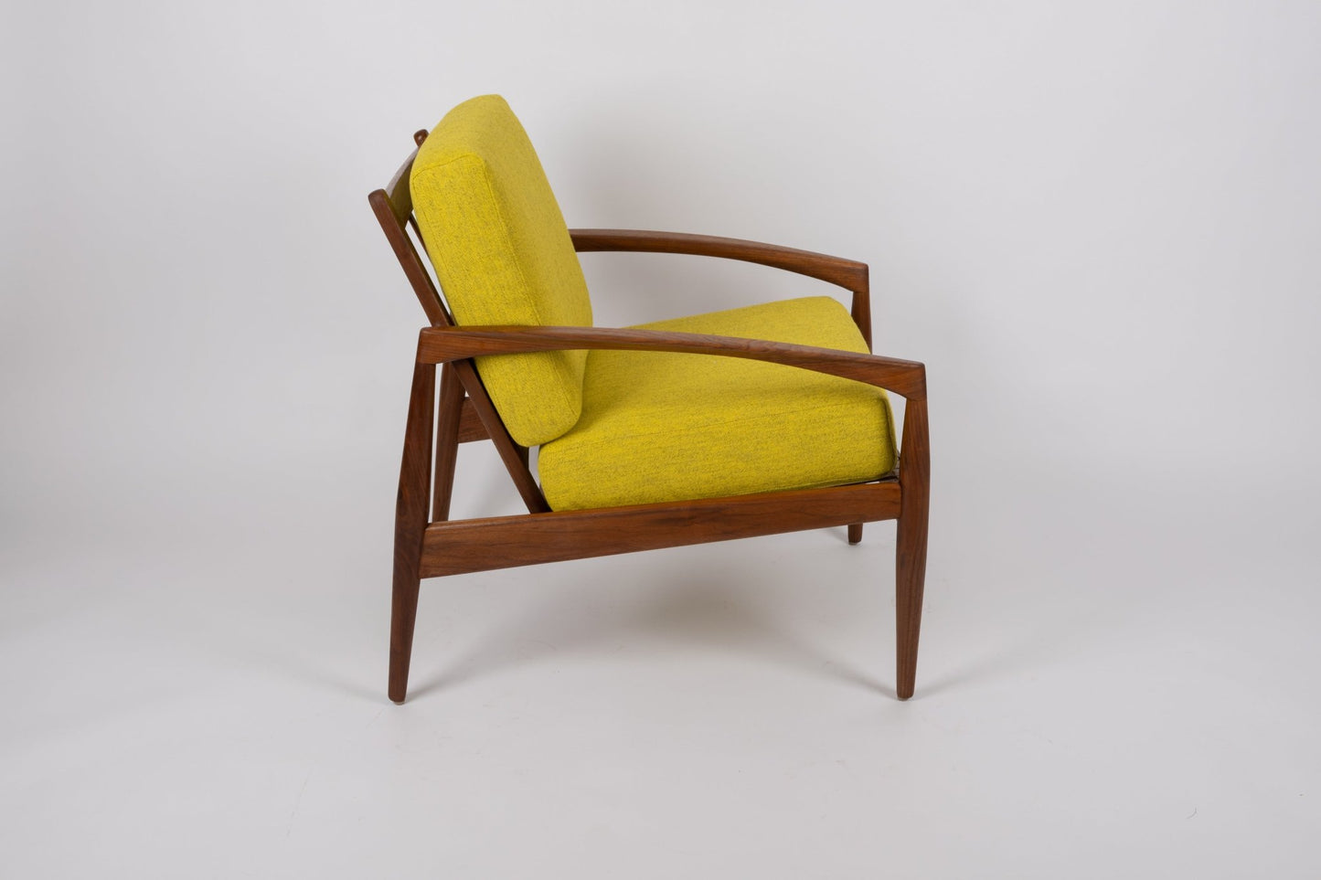 Pair of Kai Kristiansen 'Paper Knife' chairs with solid teak frames and yellow upholstery from 1950s Denmark.