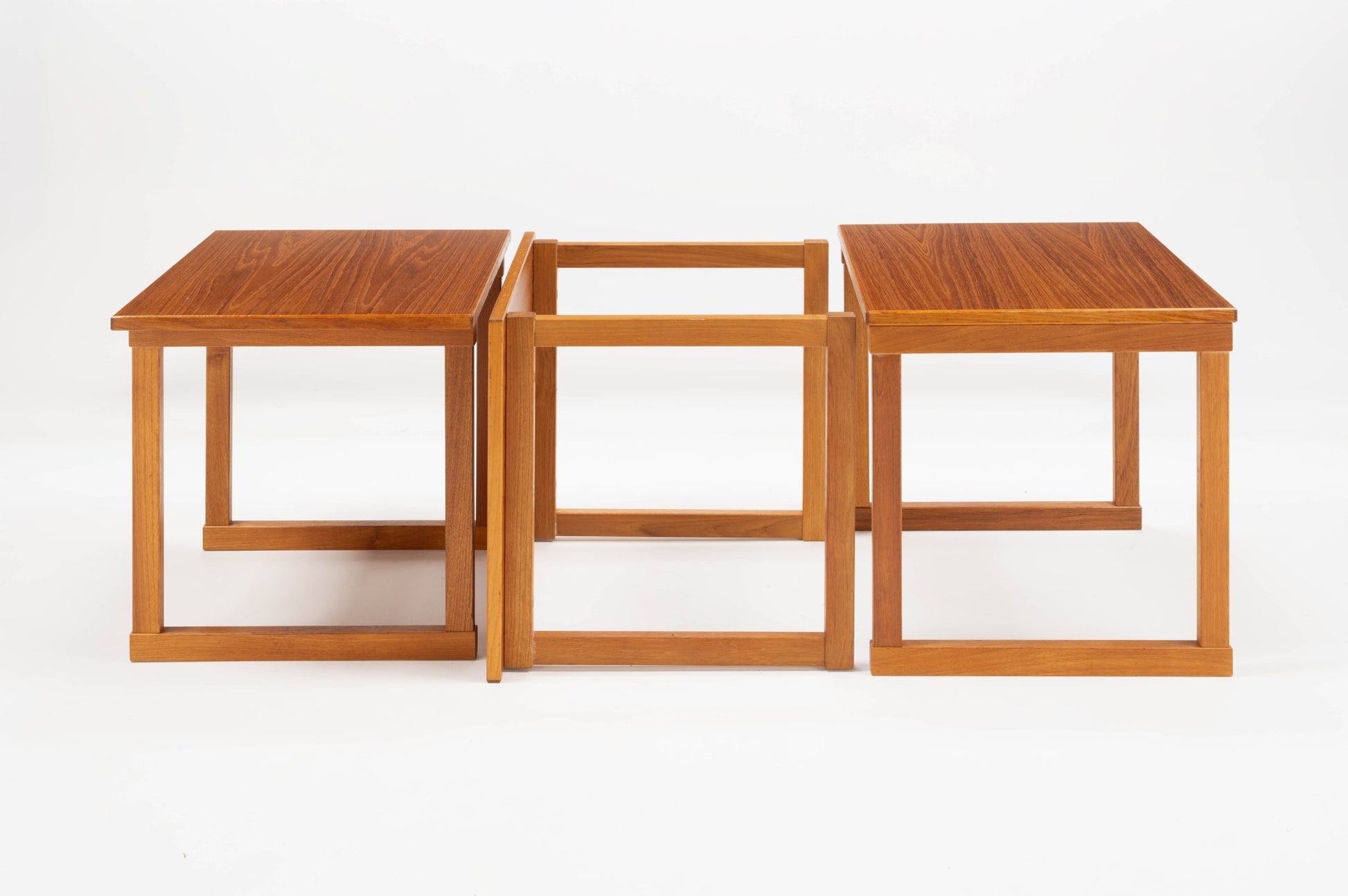 Set of three Kai Kristiansen "The Cube" teak side tables with interlocking square frames, Danish 1960s design.