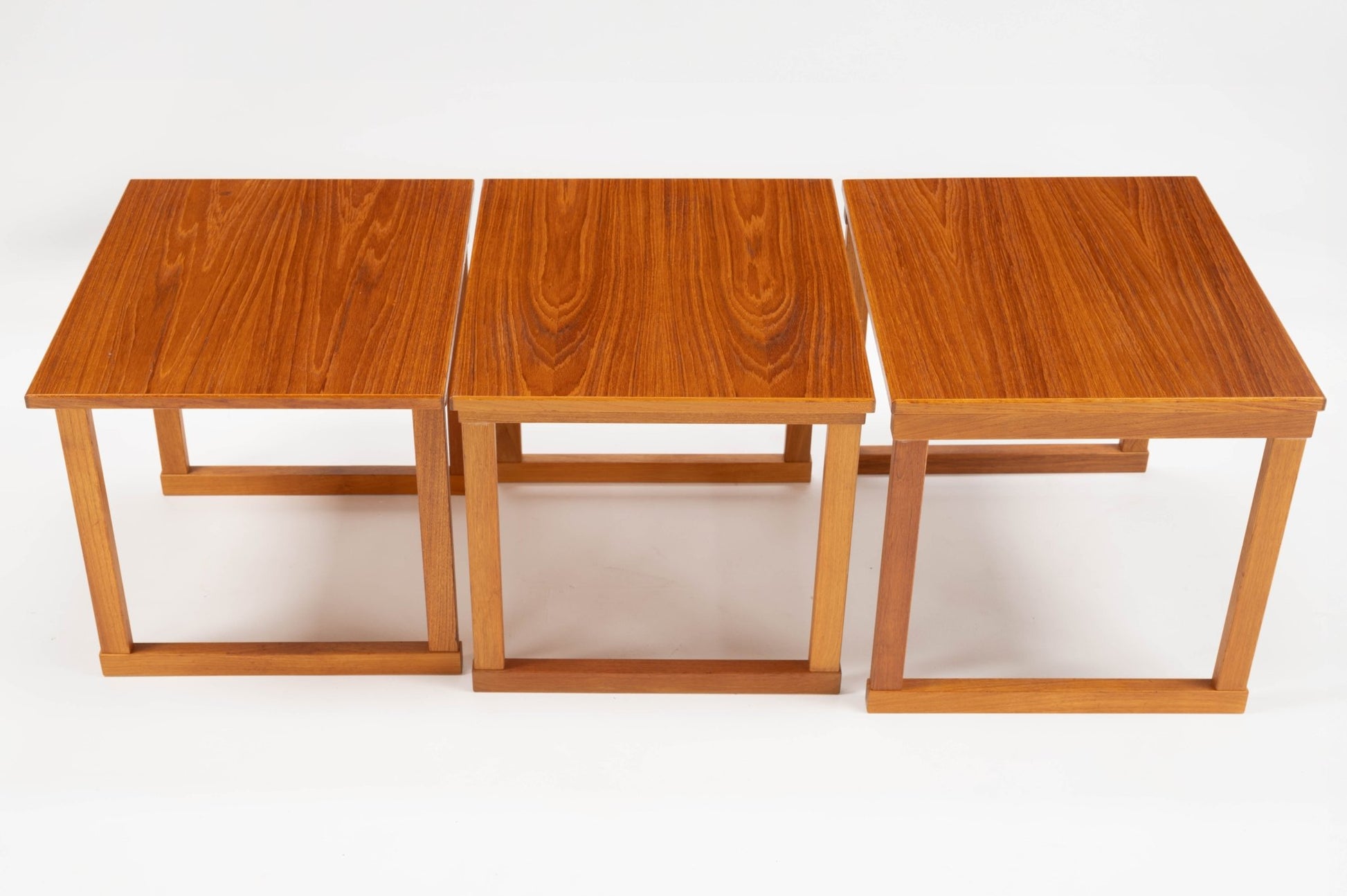 Set of three vintage mid-century modern Kai Kristiansen teak side tables titled The Cube with interlocking design