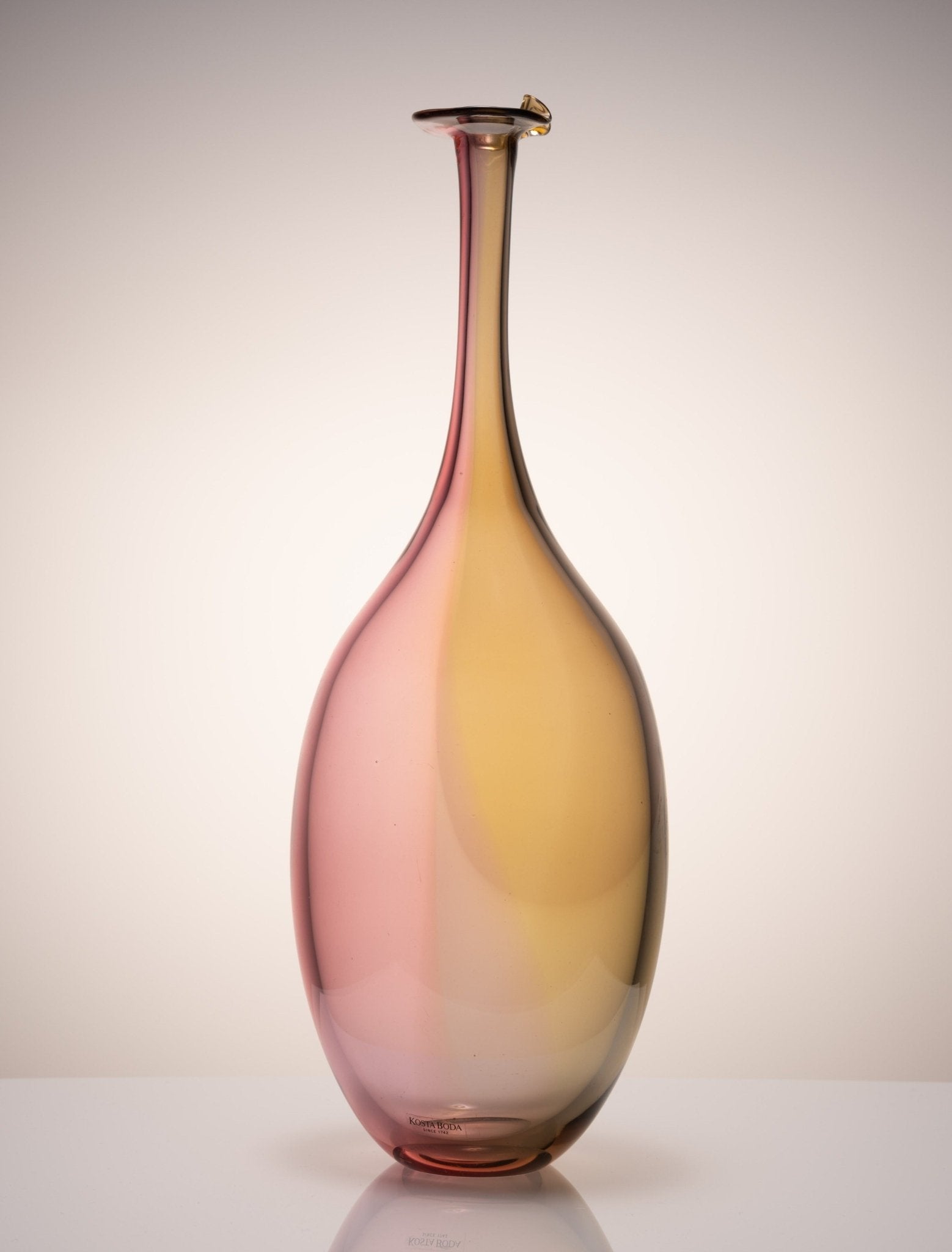 Kosta Boda Fidji glass vase by Kjell Engman with elegant multicolor gradient from pink to amber, Swedish artist collection.