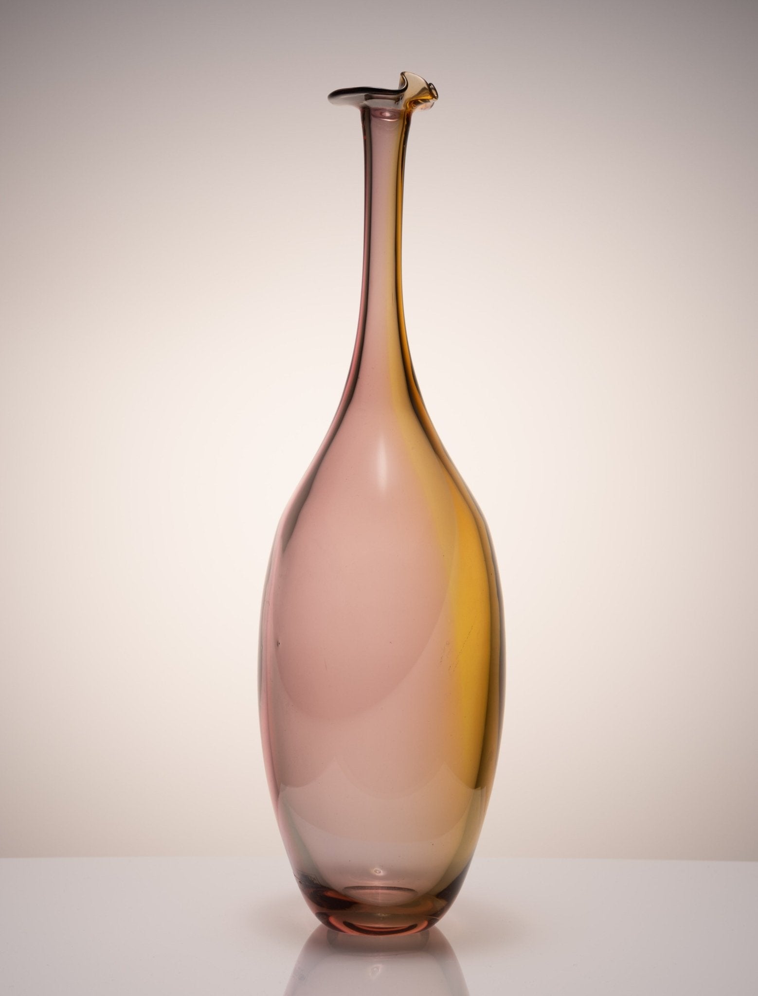 Kosta Boda Fidji glass bottle by Kjell Engman with elongated neck and multicolor gradient design from Sweden.