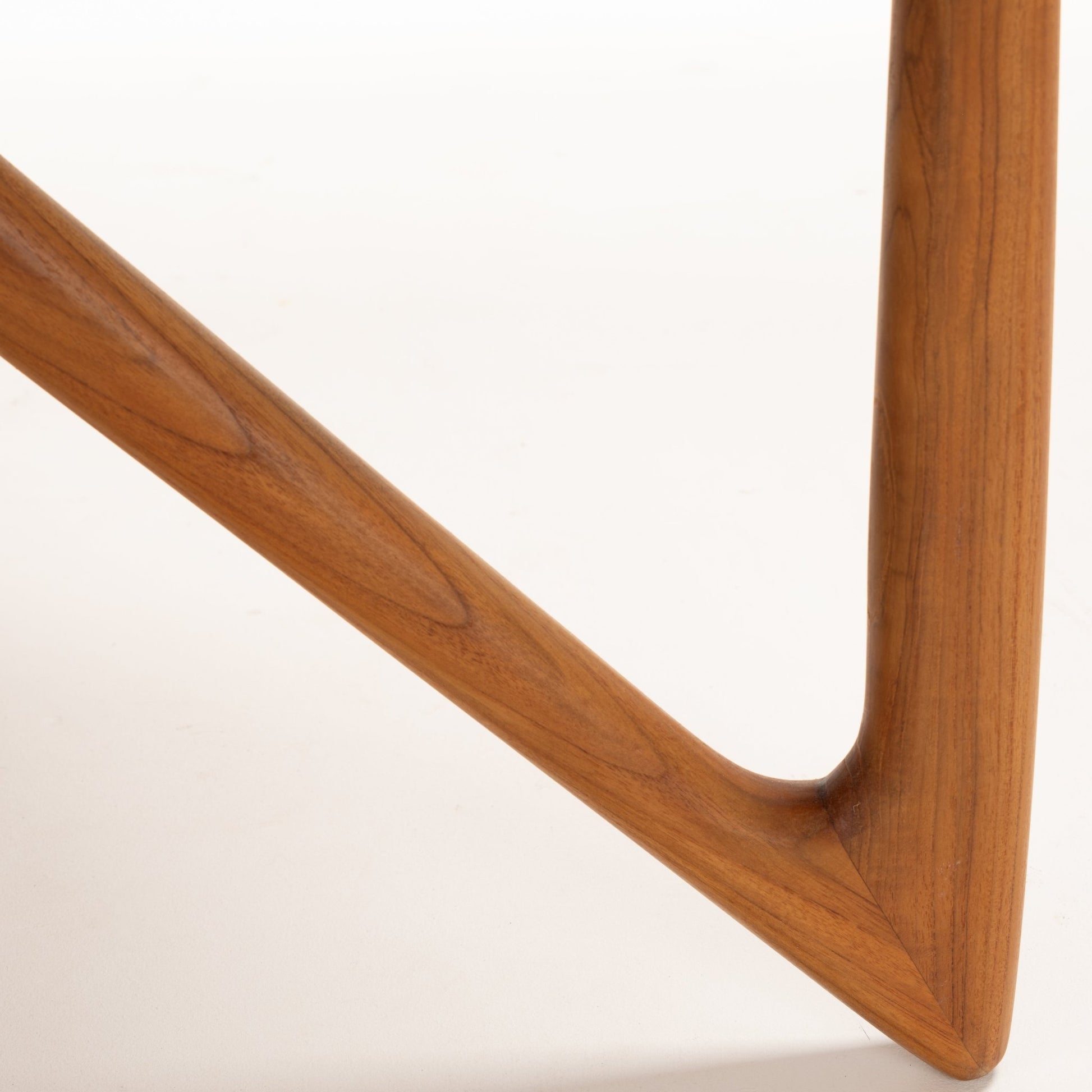 Kurt Ostervig Drop-Leaf Dining Table close detail of sculptural angled wooden support with curved joinery and rich walnut grain in mid century modern furniture style