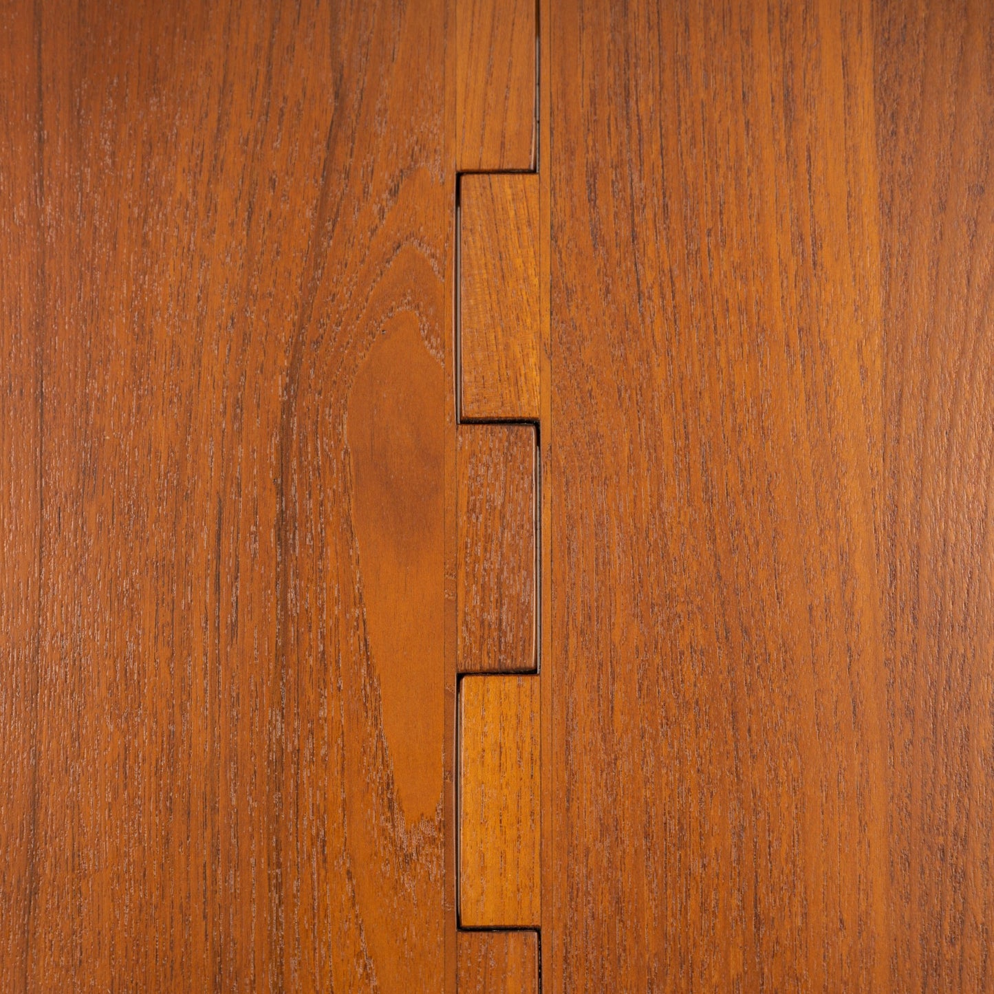 Kurt Ostervig Drop-Leaf Dining Table close detail of warm walnut surface and geometric leaf joinery showcasing crafted mid century modern furniture design