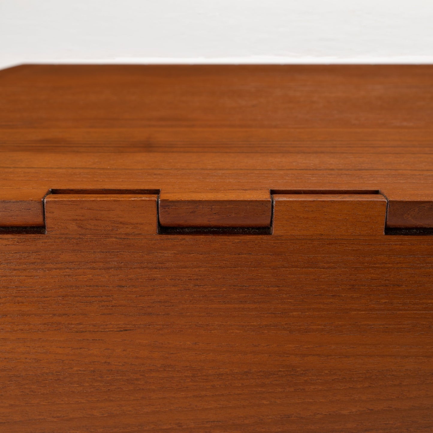 Kurt Ostervig Drop-Leaf Dining Table close up of rich walnut grain and folded leaf edge with visible joinery in vintage Danish furniture style