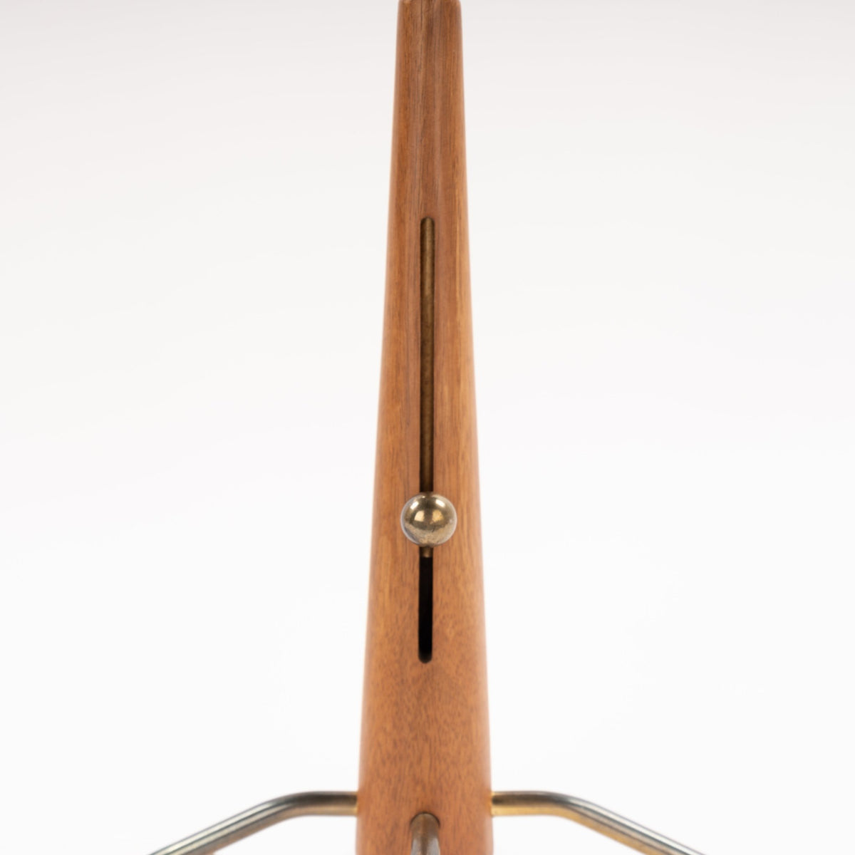 Manner of Josef Frank Table Lamp closeup of tapered wood stem with inset slot brass adjustment detail and curved metal tripod base in mid century modern lighting