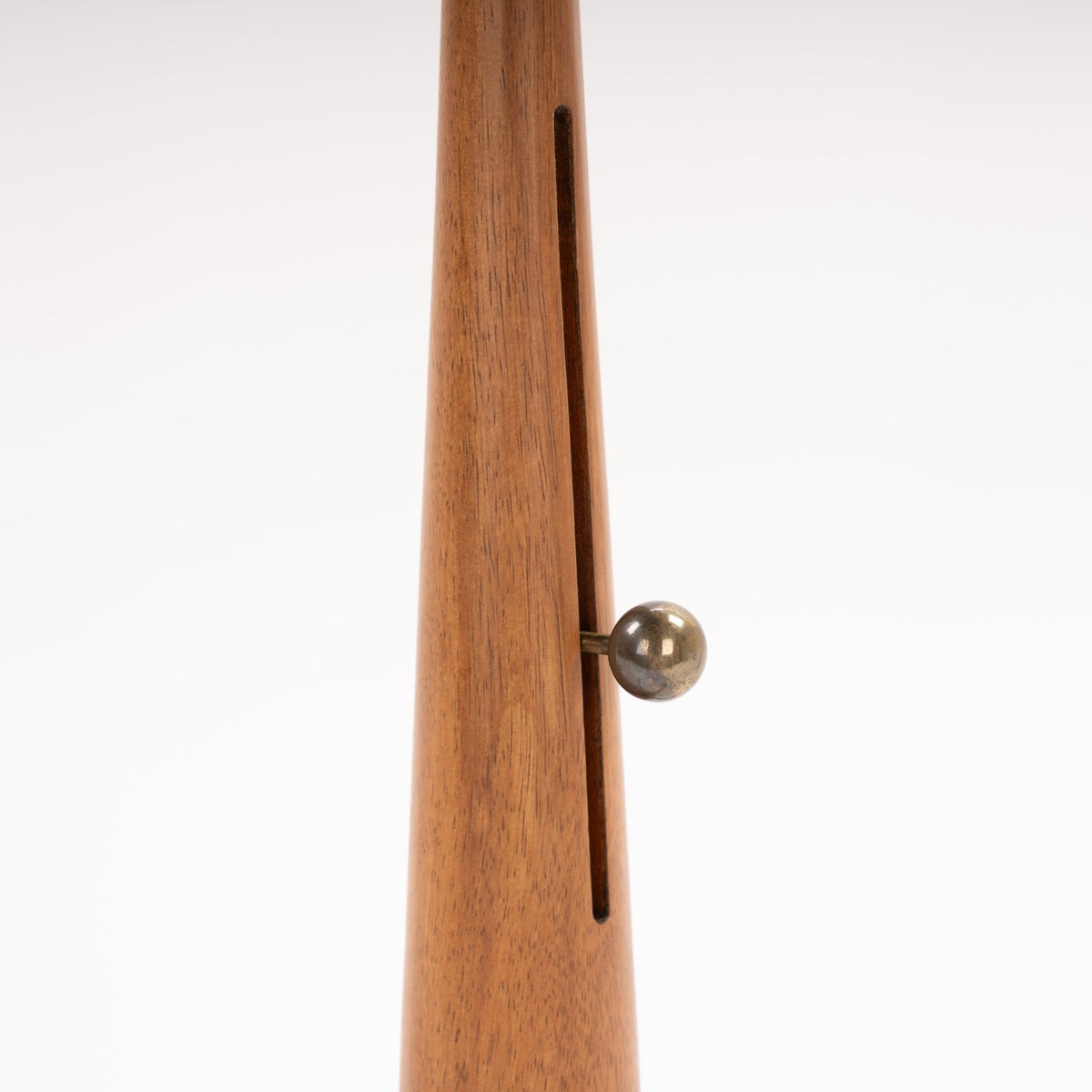 Manner of Josef Frank Table Lamp closeup of tapered wood stem with inset adjustment slot and polished metal knob in mid century modern lighting