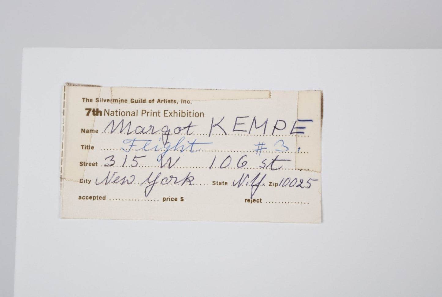 Handwritten exhibition label for Margot Kempe’s 1961 print “Flight” with address in New York on white background.