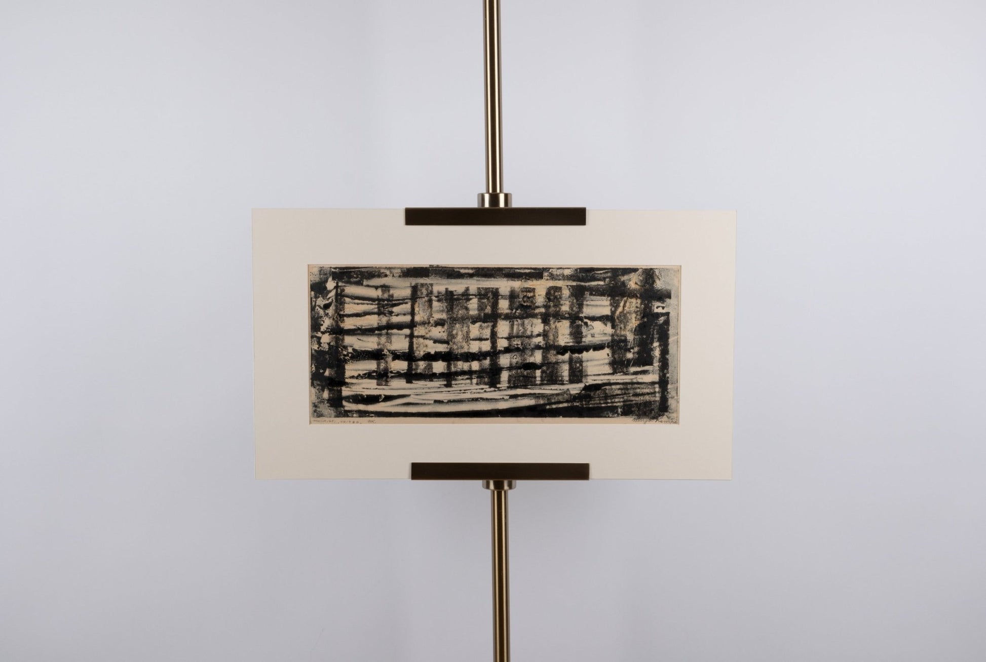 Margot Kempe abstract monotype print titled "United" with black textured lines on beige matting displayed on stand