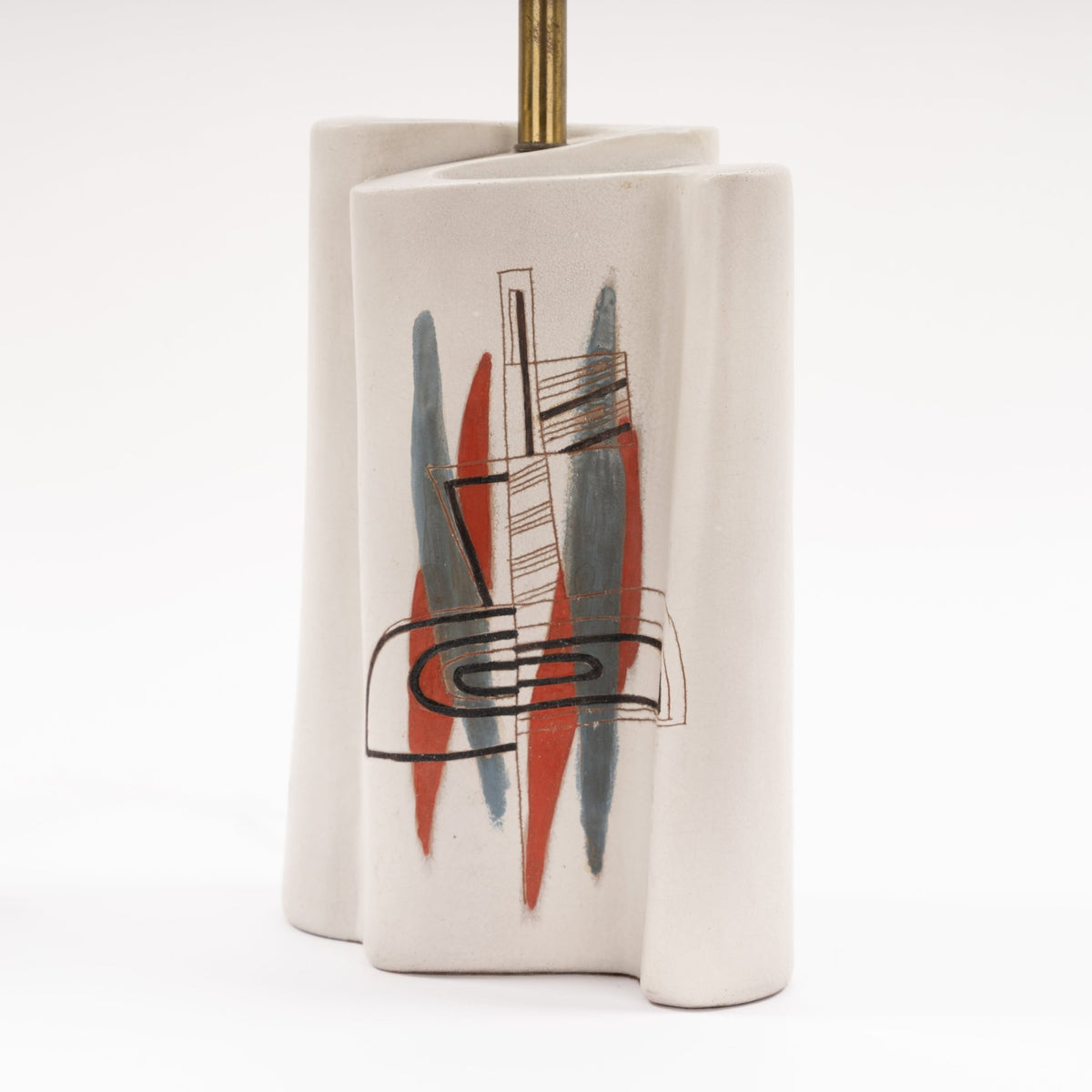 Marianna Von Allesch Table Lamp with a sculptural white ceramic base featuring abstract red blue and black artwork and a brass stem in mid century modern lighting