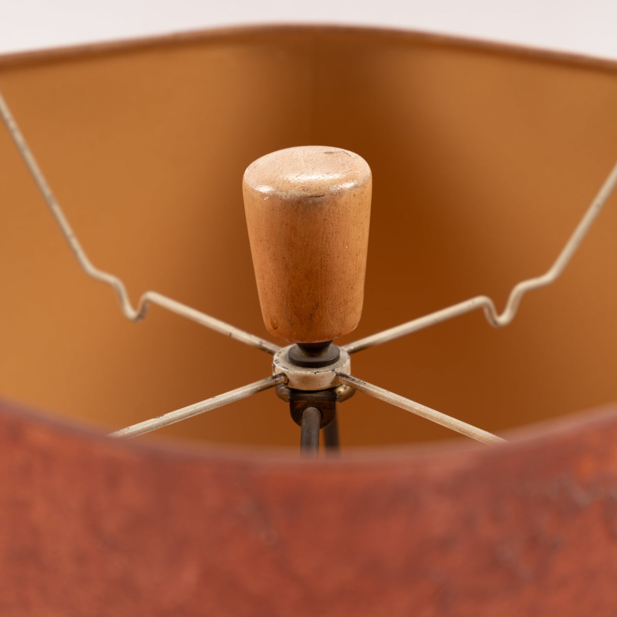 Marianna Von Allesch Table Lamp close up showing a warm brown shade interior wood finial and metal support frame in mid century modern lighting