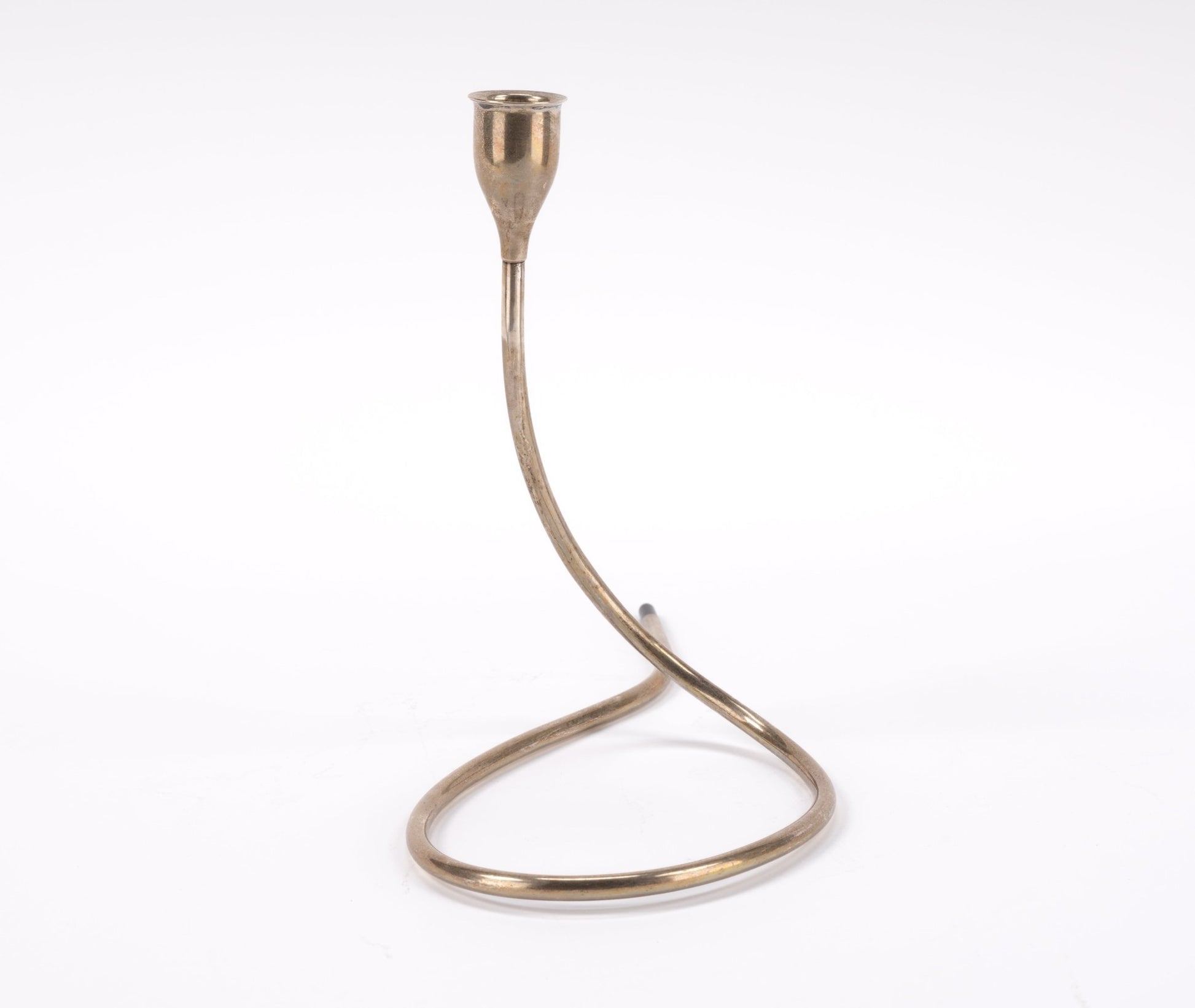 Mid-century Marion Anderson sterling silver candlestick with curved tubular form and plastic tip on white background