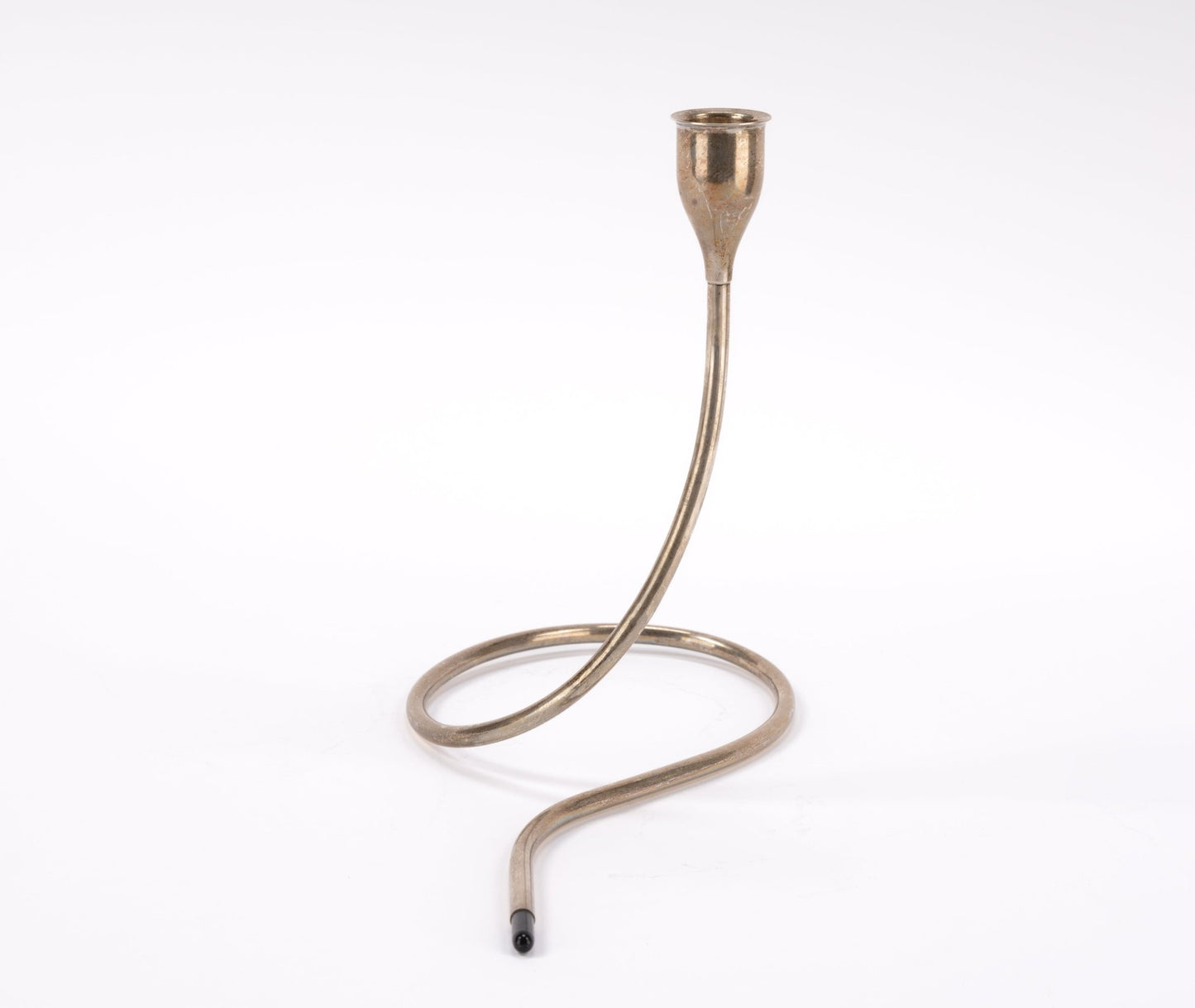 Mid-century sterling silver candlestick by Marion Anderson with curving tubular form and black plastic tip