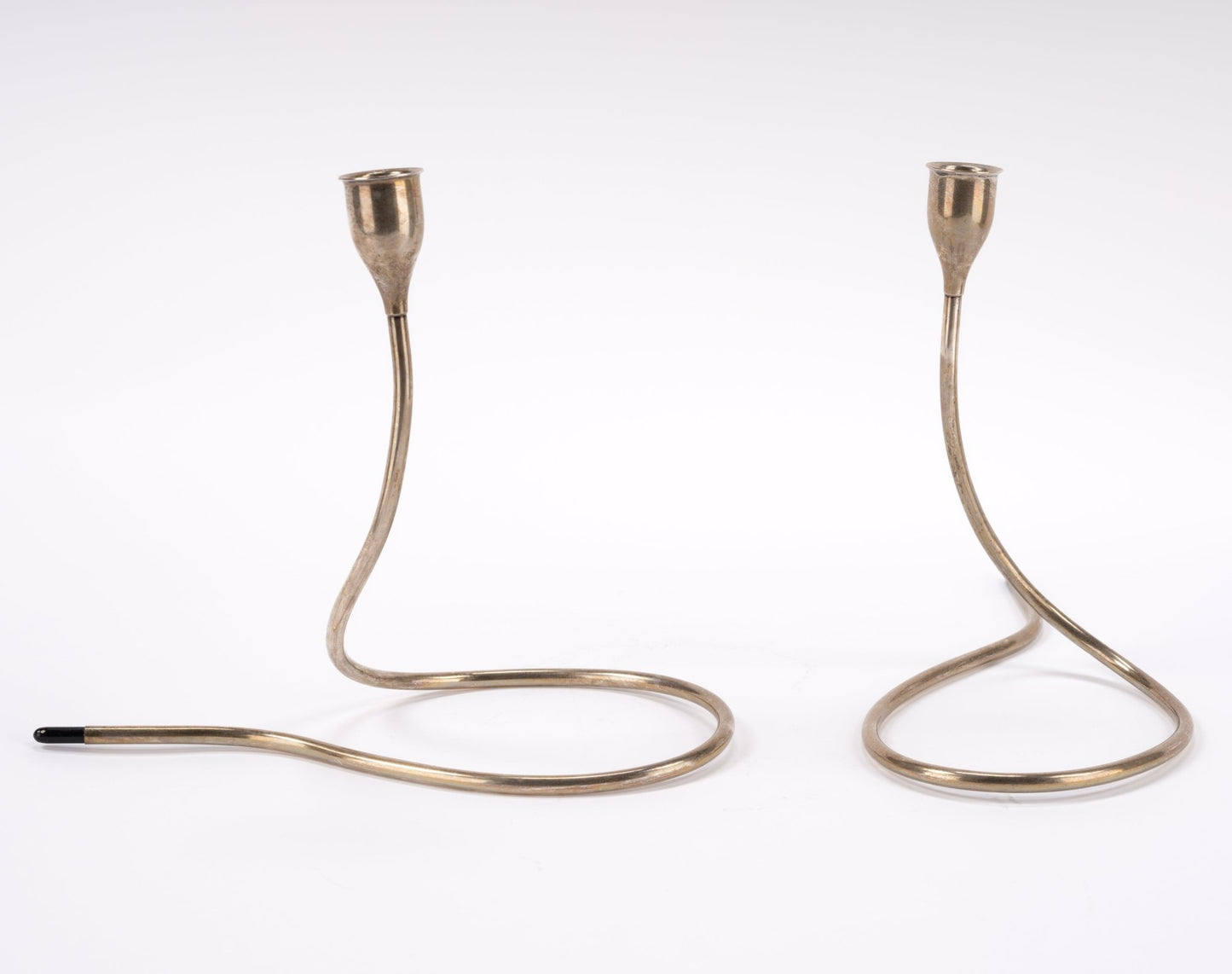 Pair of mid-century modern Marion Anderson sterling silver candlesticks with plastic accents and curved tubular design