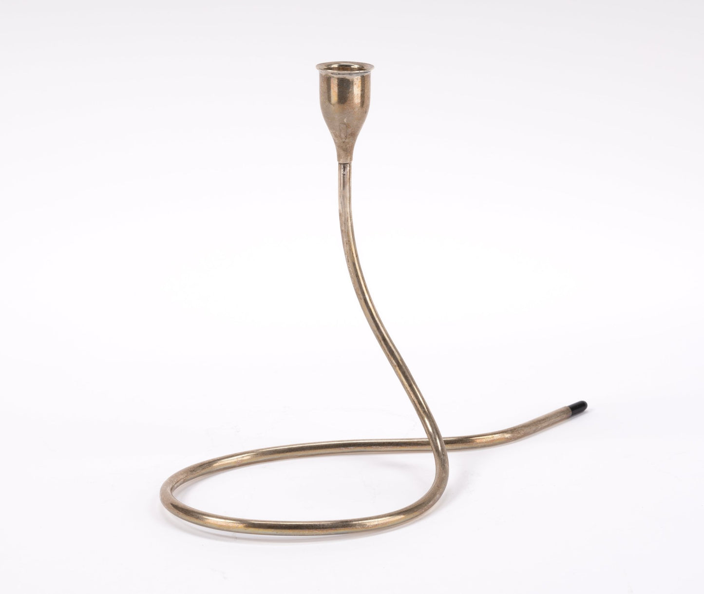 Mid-century sterling silver candlestick by Marion Anderson with curved tubular form and plastic tip on white background