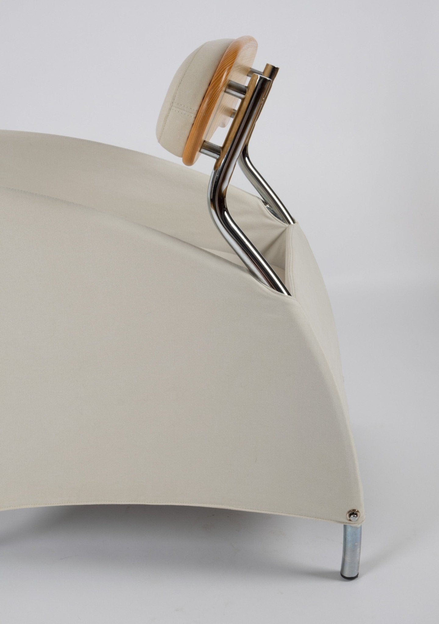 Close-up of 1980s Massimo Iosa Ghini Memphis-style armchair in cream canvas with chrome and wooden backrest detail