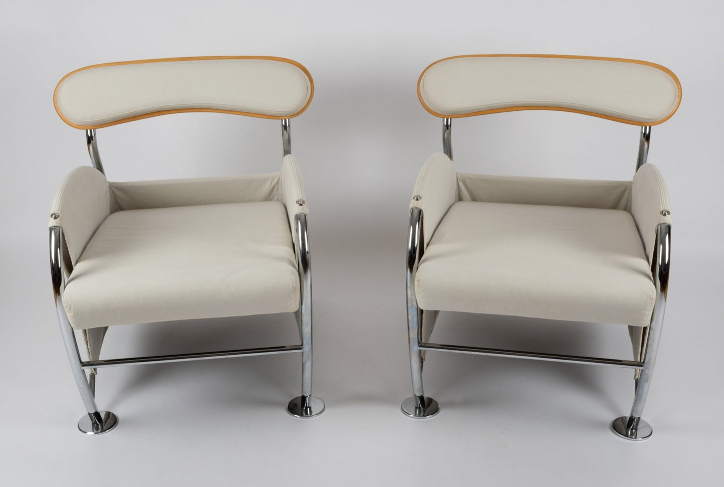 Pair of 1980s Massimo Iosa Ghini Memphis-style armchairs with chrome frames and beige canvas upholstery from Italy.