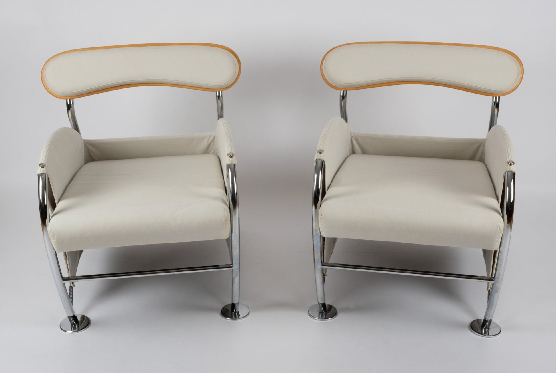 Pair of 1980s Massimo Iosa Ghini Memphis-style armchairs with chrome frames and beige canvas upholstery from Italy.